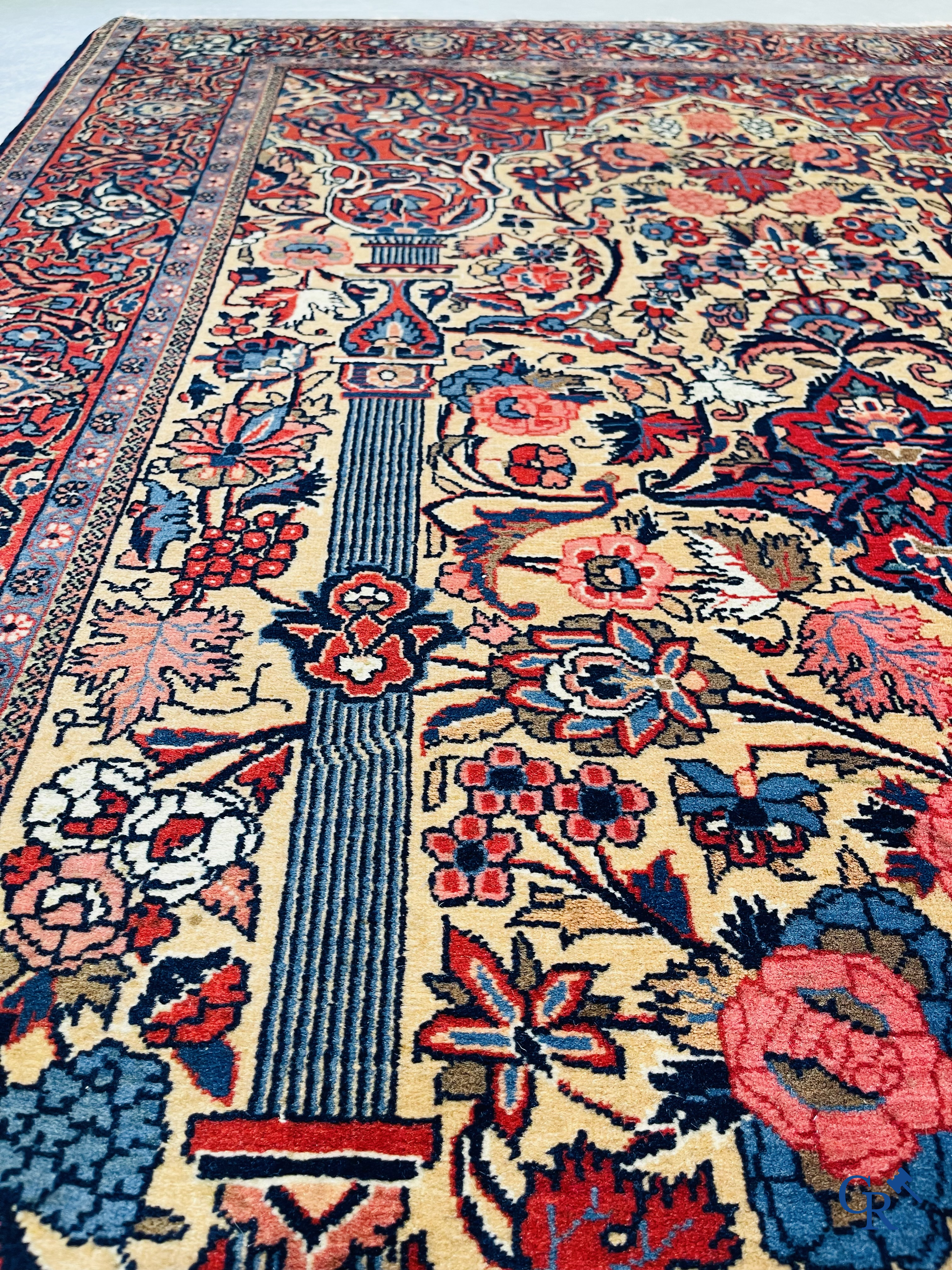 Oriental carpets: Iran. 2 antique hand-knotted Persian carpets with floral decor.