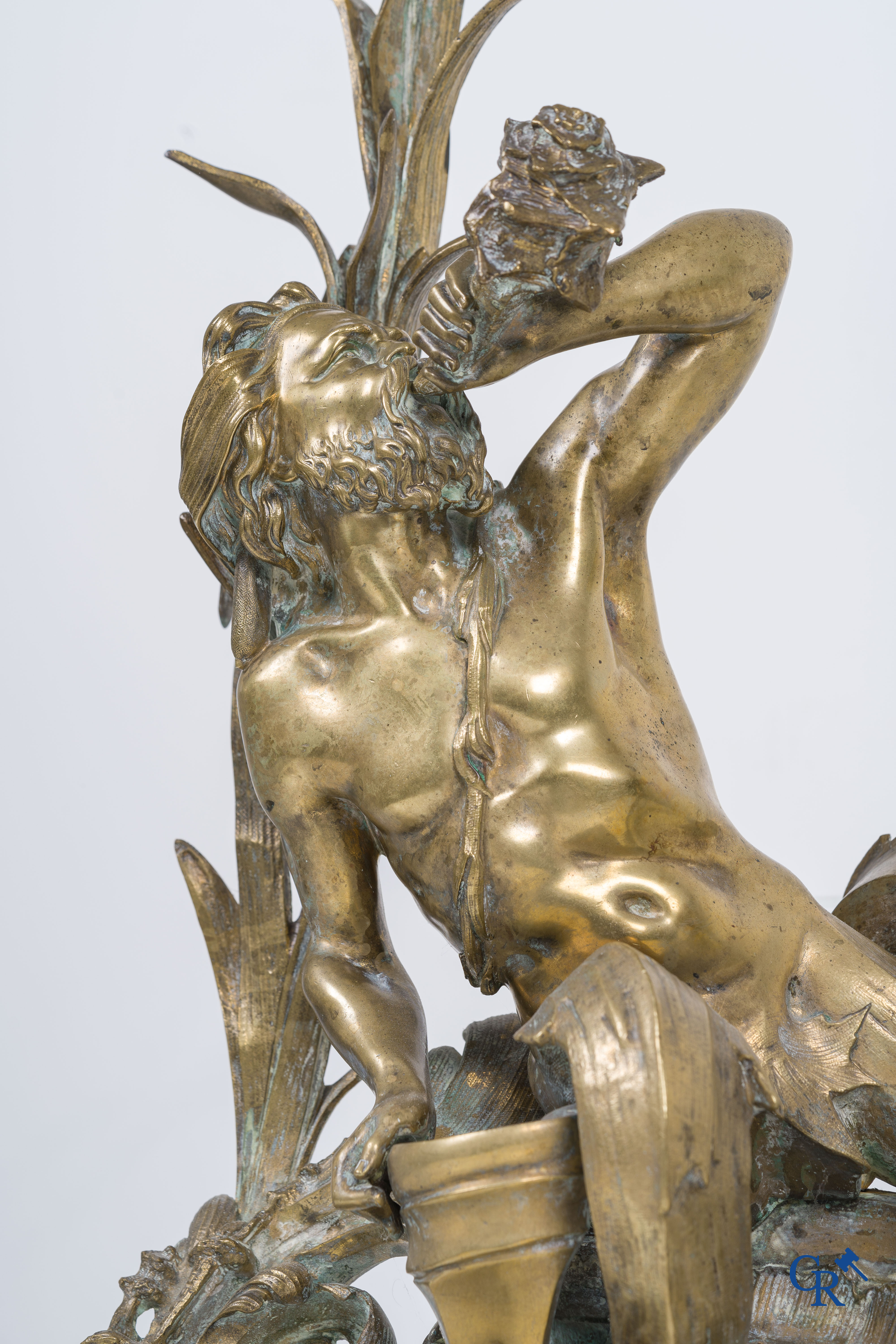 A large pair of finely chiseled bronze chenets with Tritons. Louis XV style. Napoleon III period.