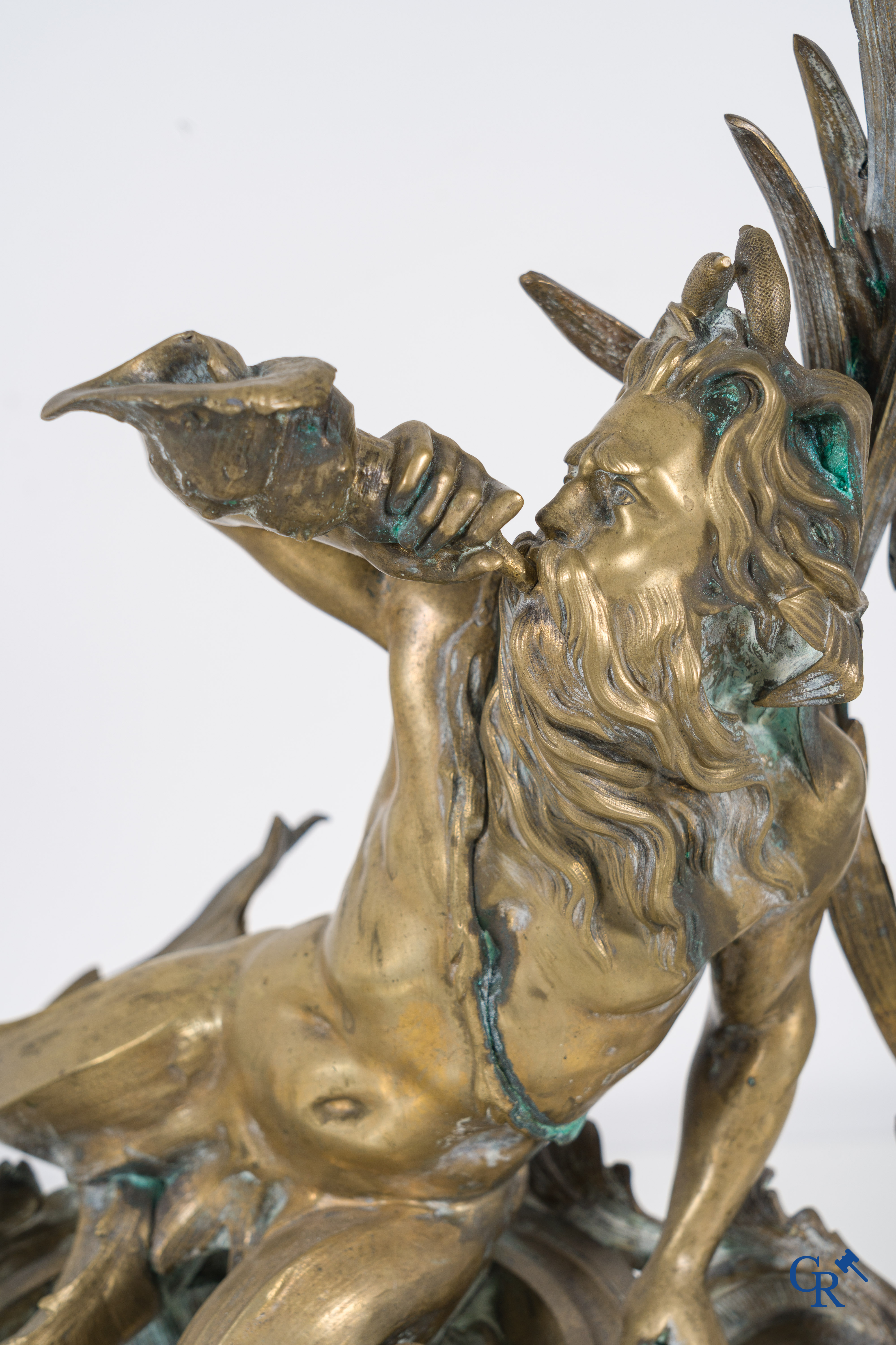 A large pair of finely chiseled bronze chenets with Tritons. Louis XV style. Napoleon III period.