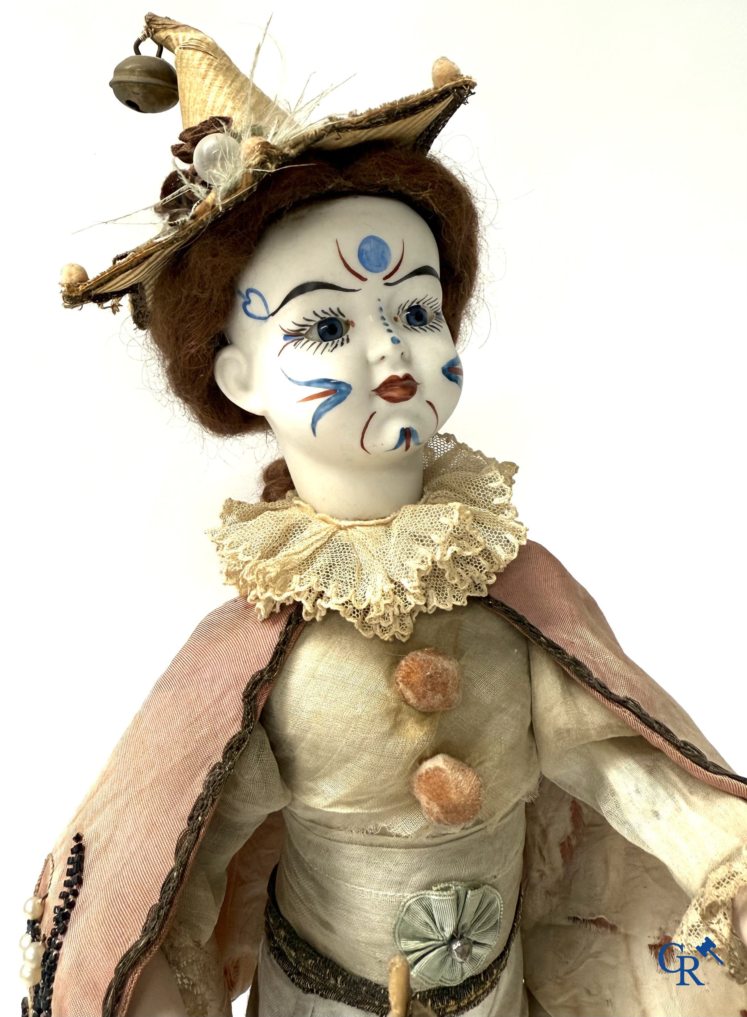 Lambert, Automaat. Clown met bewegingsmechanisme, muziek en porselein hoofd. Circa 1900.