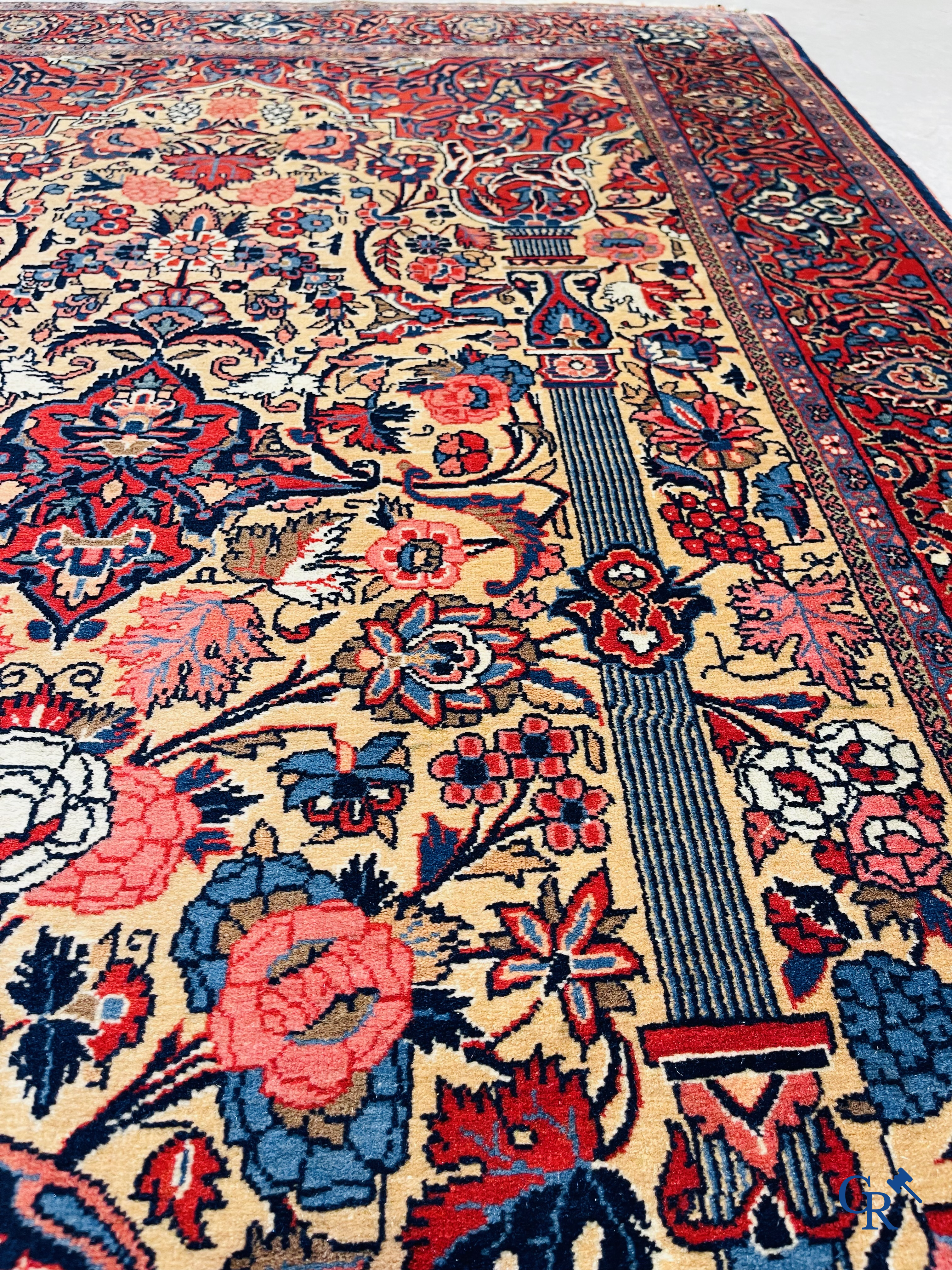 Oriental carpets: Iran. 2 antique hand-knotted Persian carpets with floral decor.