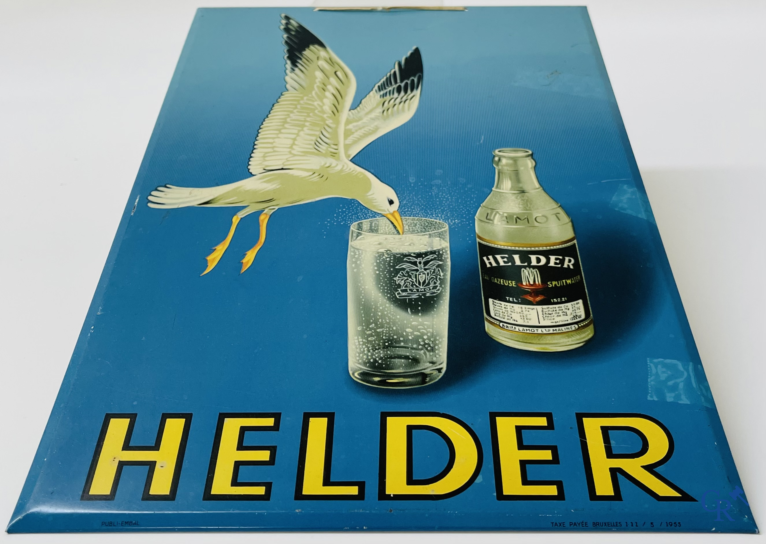 Helder, Reclamebord in bedrukt metaal voor Lamot spuitwater. Taxe payée Bruxelles 111/5/1955.