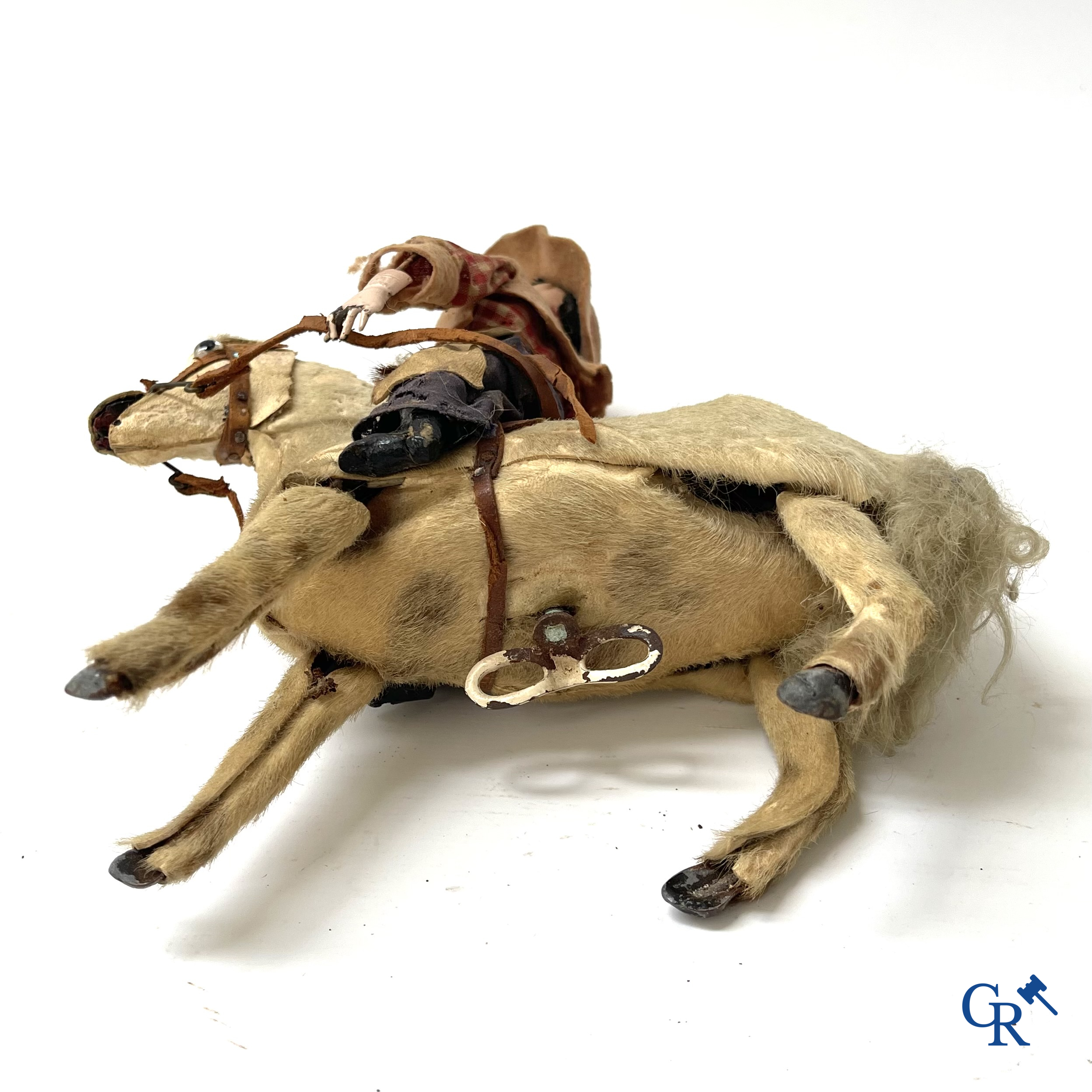 Oud speelgoed. Roullet & Decamps. "Cheval sauteur cowboy" Mechanisch speelgoedpaardje met cowboy. Circa 1910-1920.
