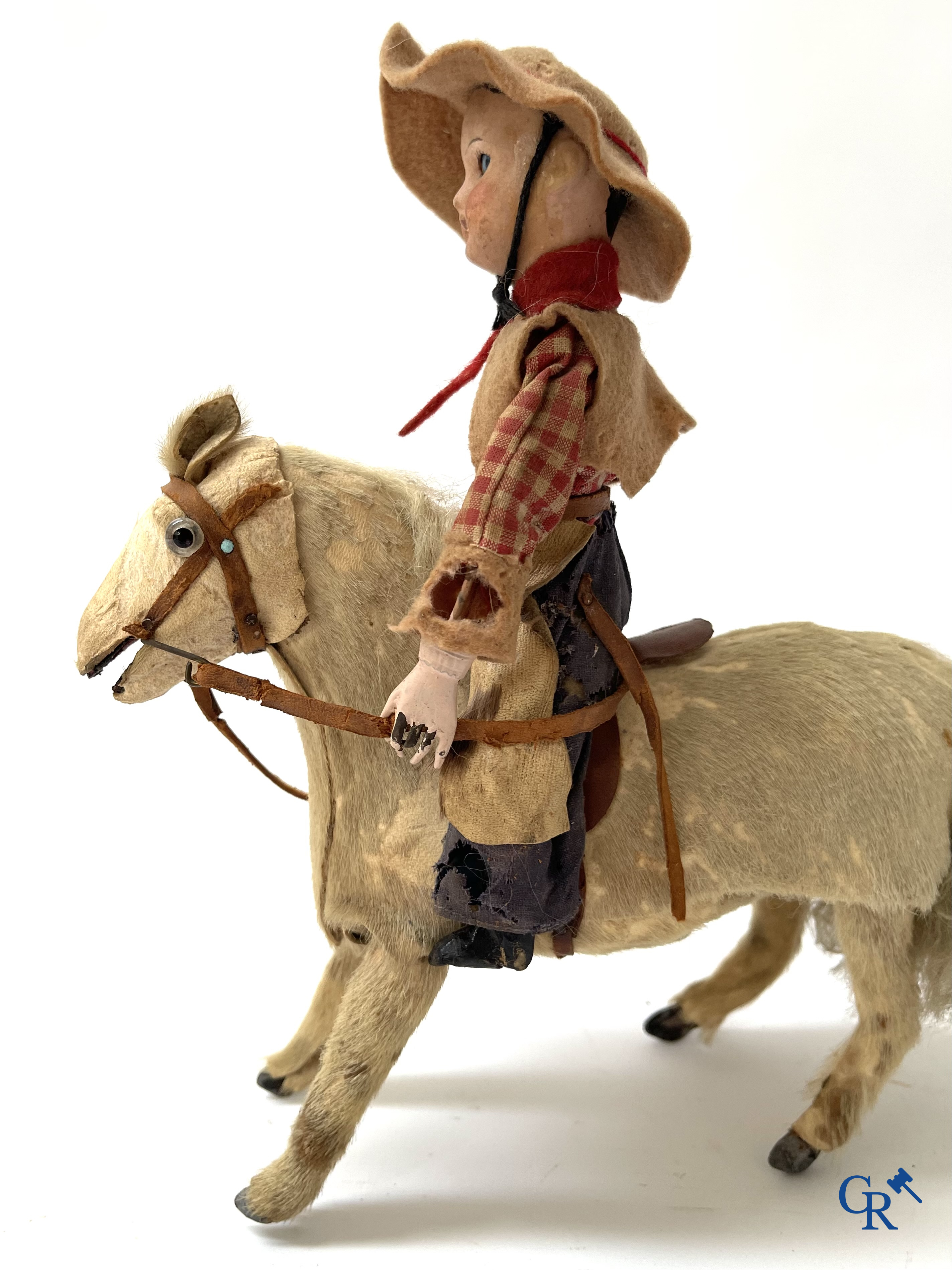 Oud speelgoed. Roullet & Decamps. "Cheval sauteur cowboy" Mechanisch speelgoedpaardje met cowboy. Circa 1910-1920.
