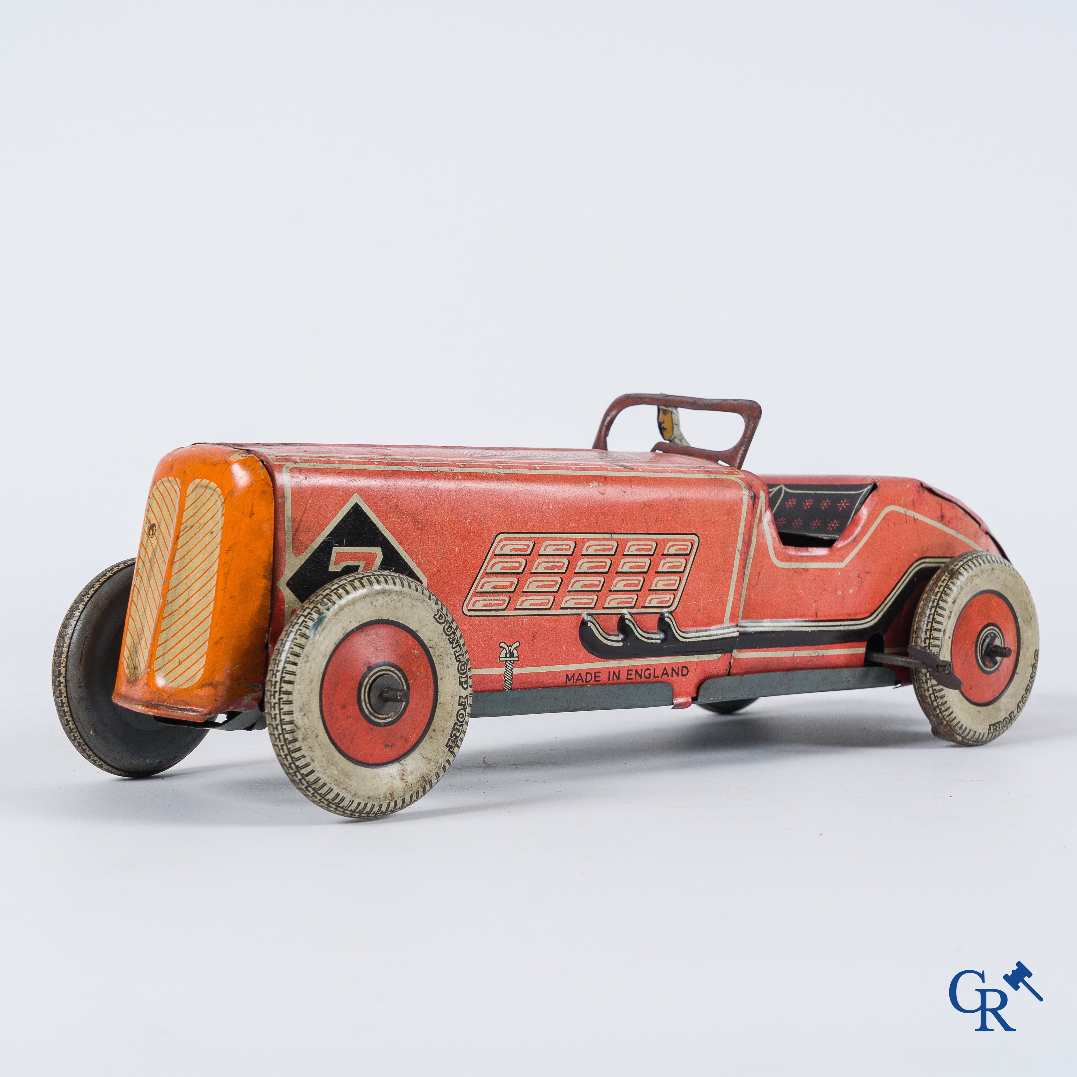 Oud speelgoed. Made in England. Racewagen met autopiloot. Blik met opwindmechanisme. Jaren '30-'40.