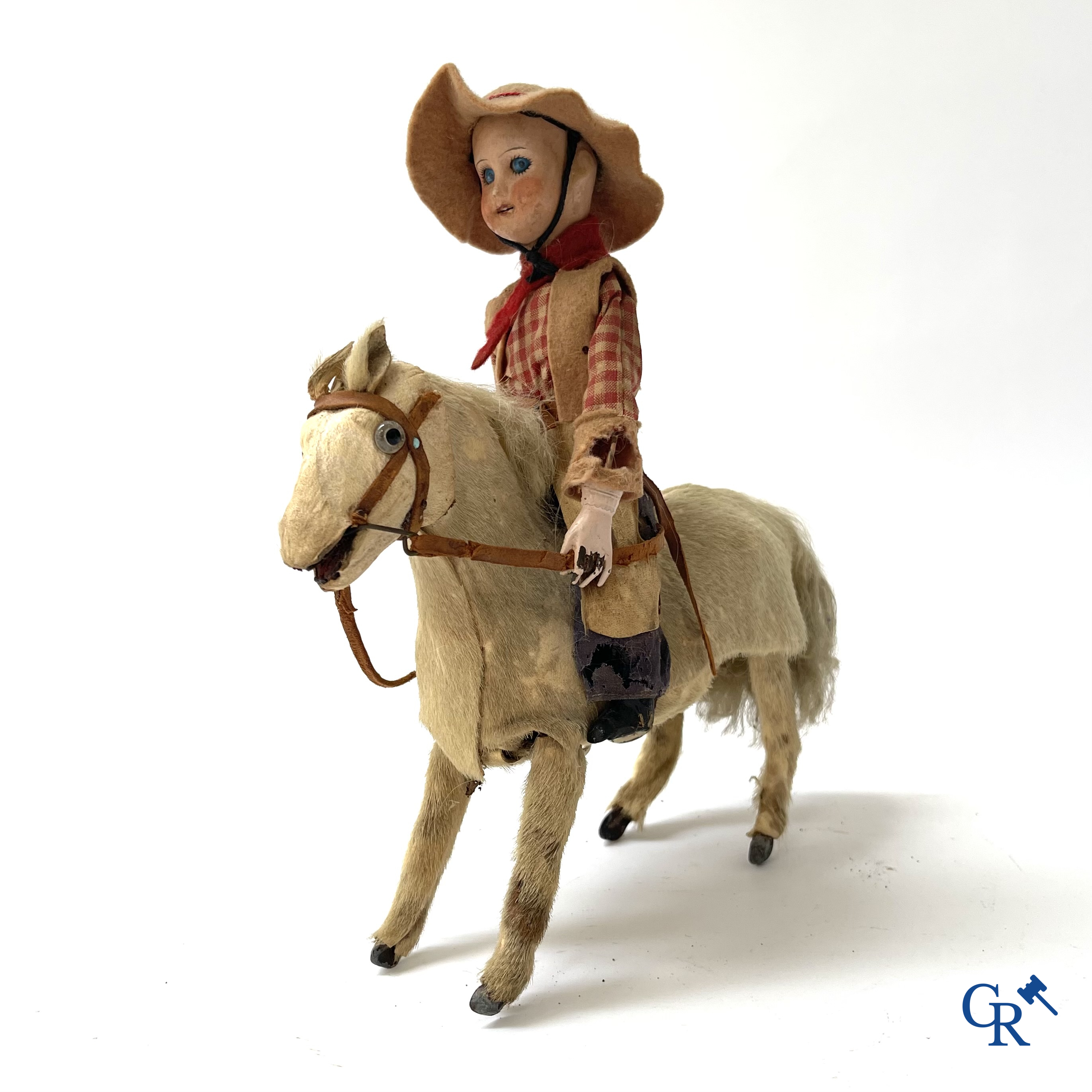 Oud speelgoed. Roullet & Decamps. "Cheval sauteur cowboy" Mechanisch speelgoedpaardje met cowboy. Circa 1910-1920.