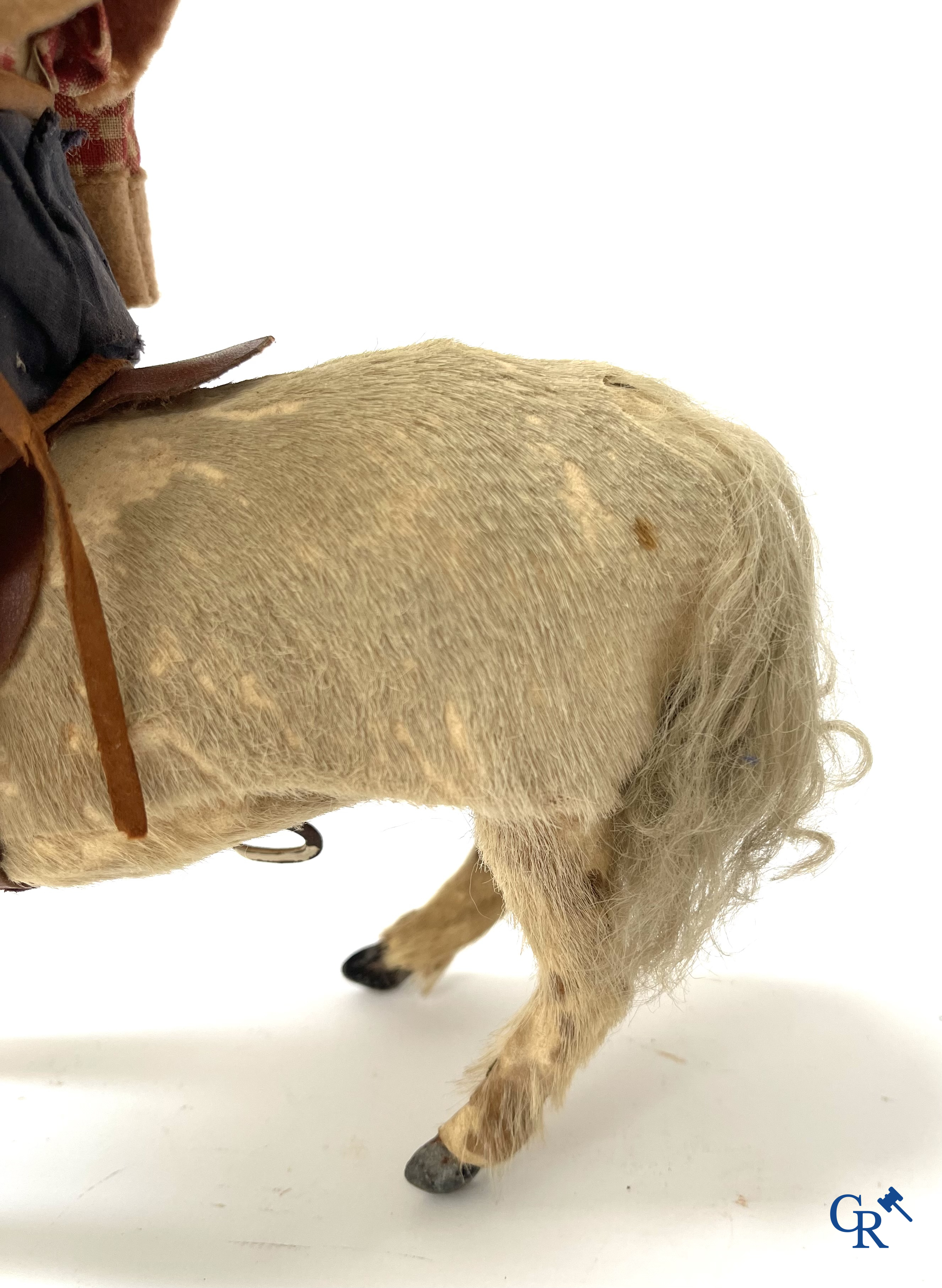Oud speelgoed. Roullet & Decamps. "Cheval sauteur cowboy" Mechanisch speelgoedpaardje met cowboy. Circa 1910-1920.