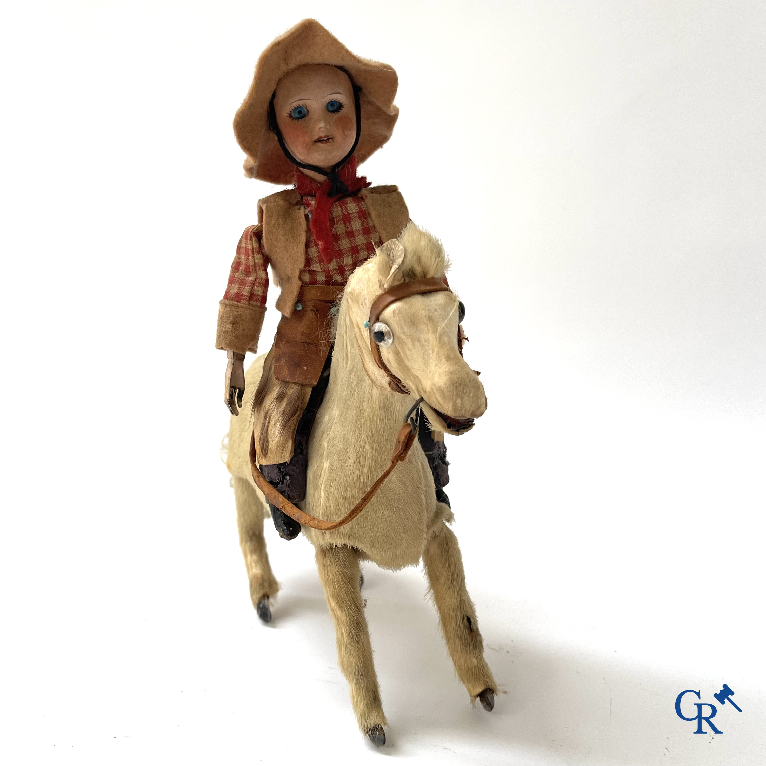 Oud speelgoed. Roullet & Decamps. "Cheval sauteur cowboy" Mechanisch speelgoedpaardje met cowboy. Circa 1910-1920.