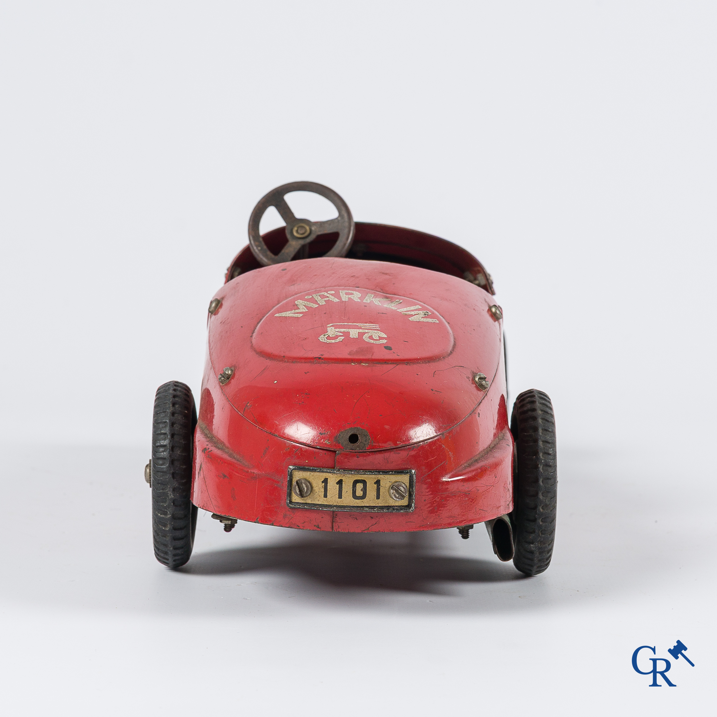 Märklin. Oud speelgoed. Originele opwindbare Mercedes modelauto in beschilderd blik. 30'er jaren.