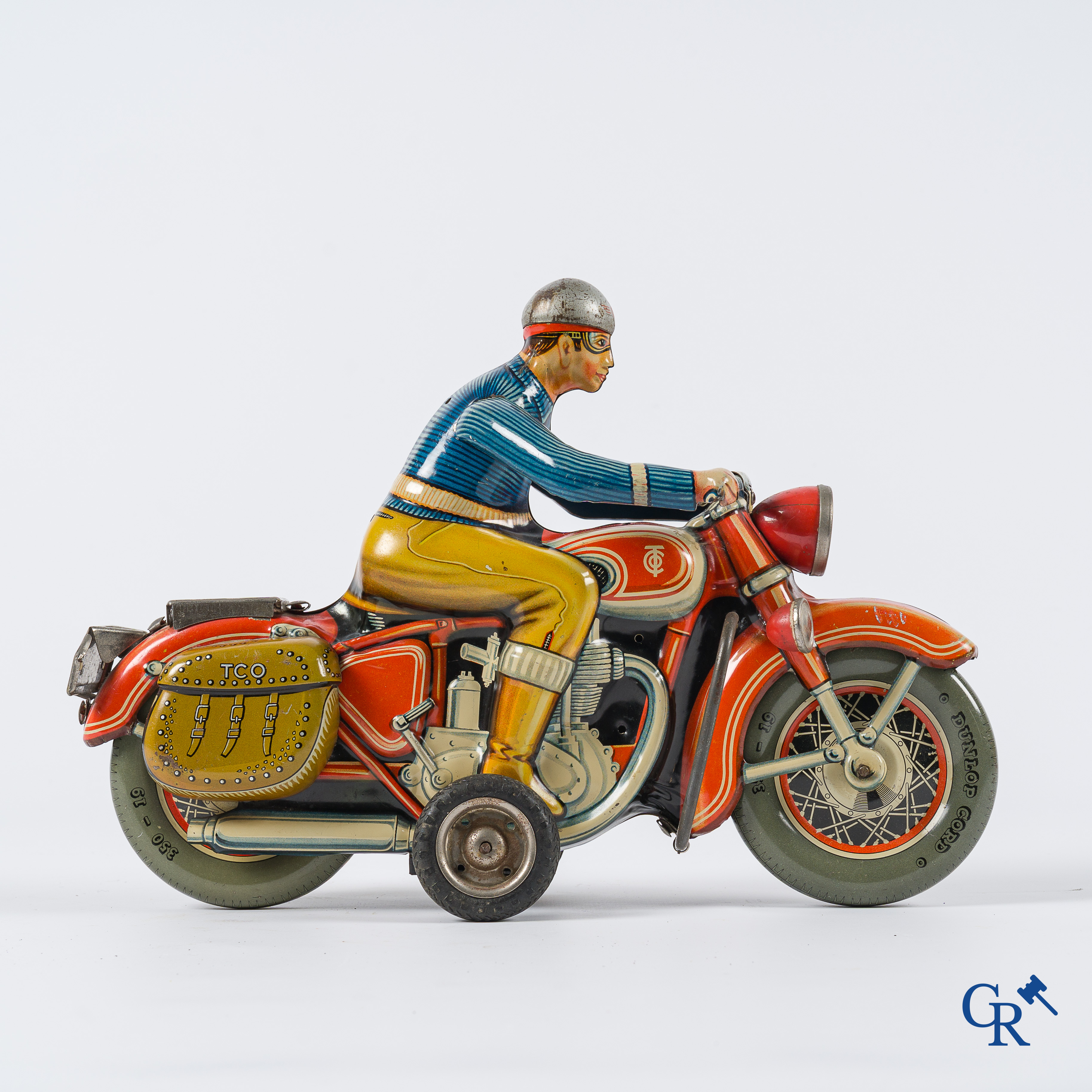 Oud speelgoed. Tipco, Western Germany. Motorfiets in beschilderd blik. Jaren '50.