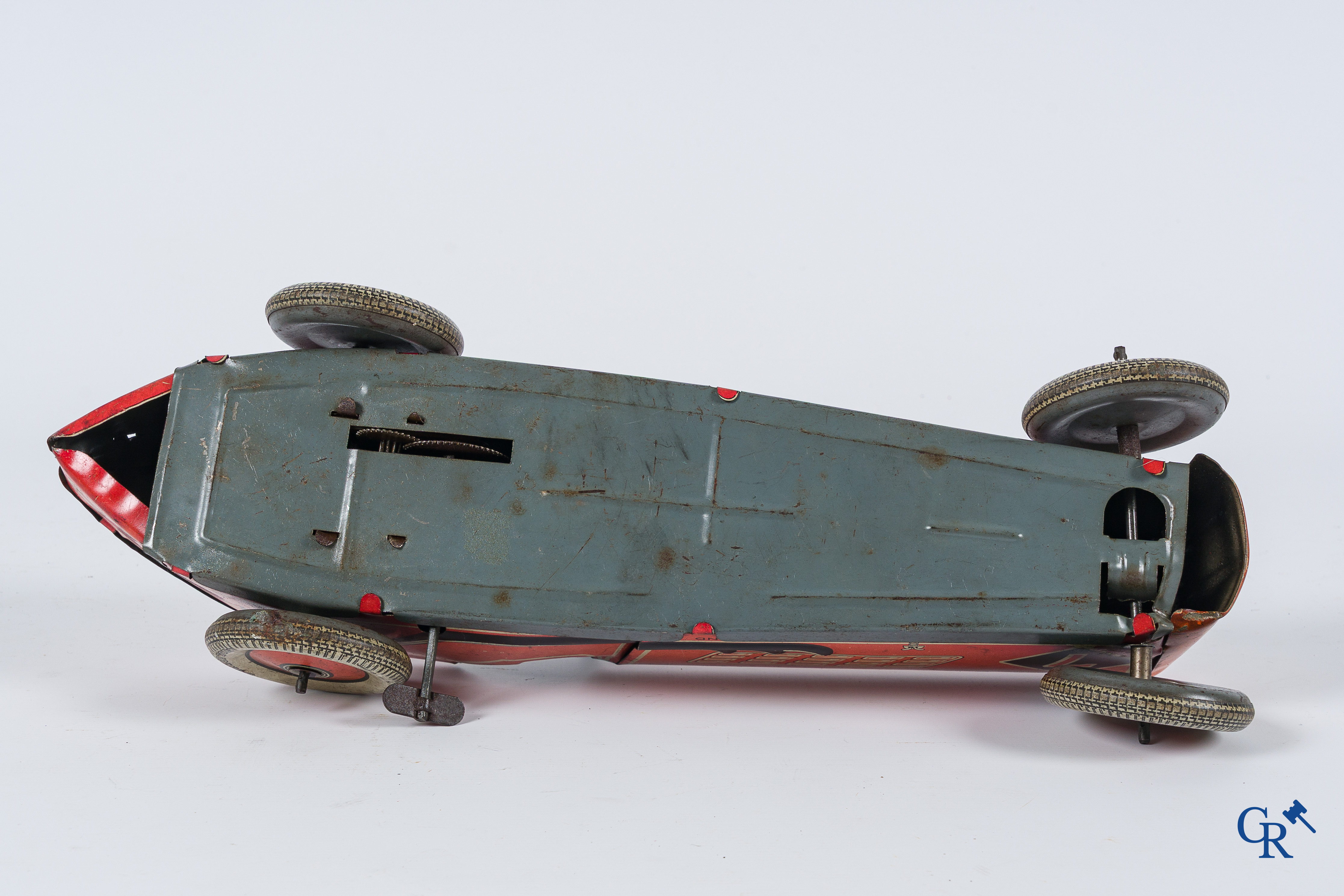 Oud speelgoed. Made in England. Racewagen met autopiloot. Blik met opwindmechanisme. Jaren '30-'40.