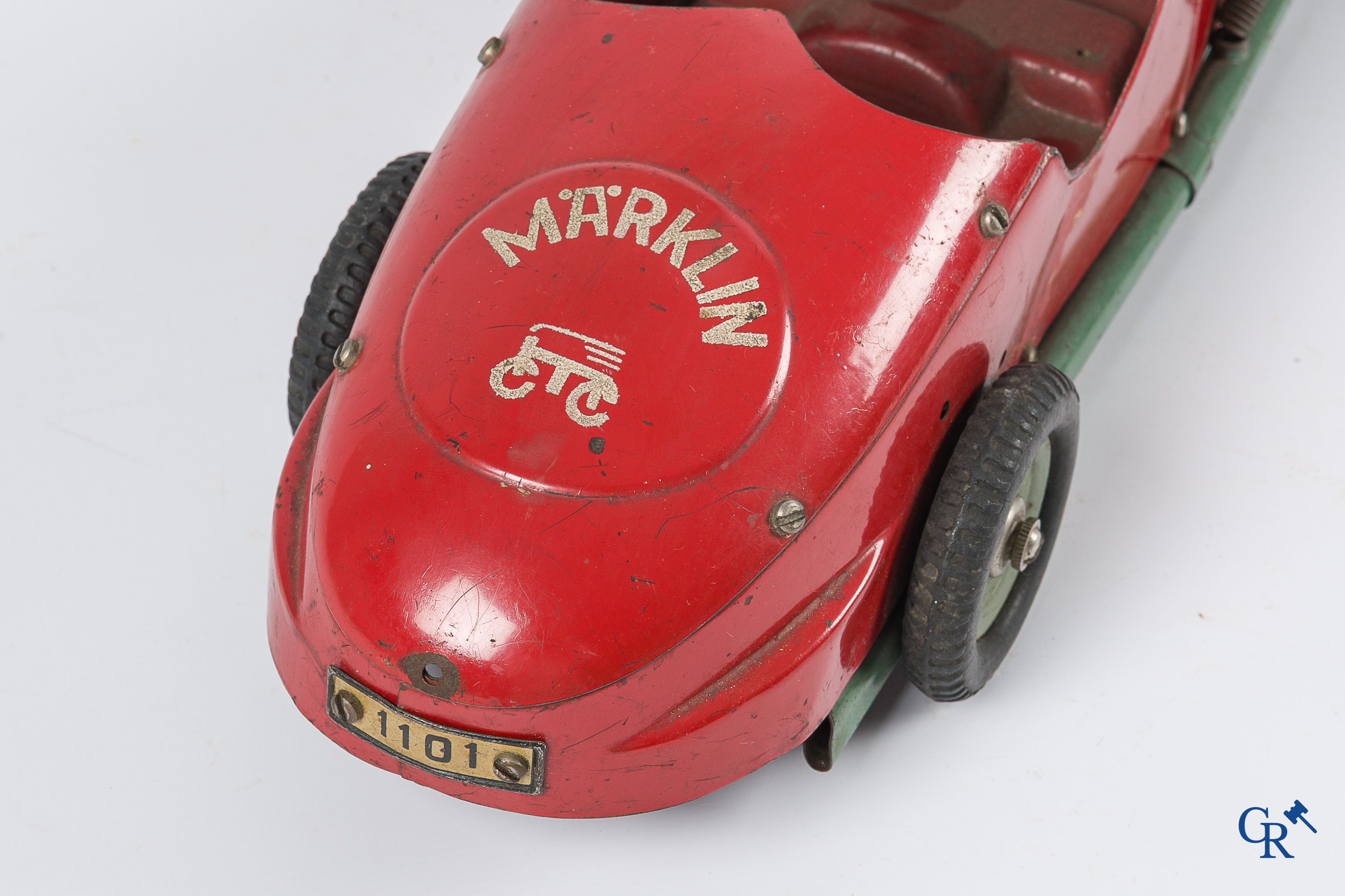 Märklin. Oud speelgoed. Originele opwindbare Mercedes modelauto in beschilderd blik. 30'er jaren.