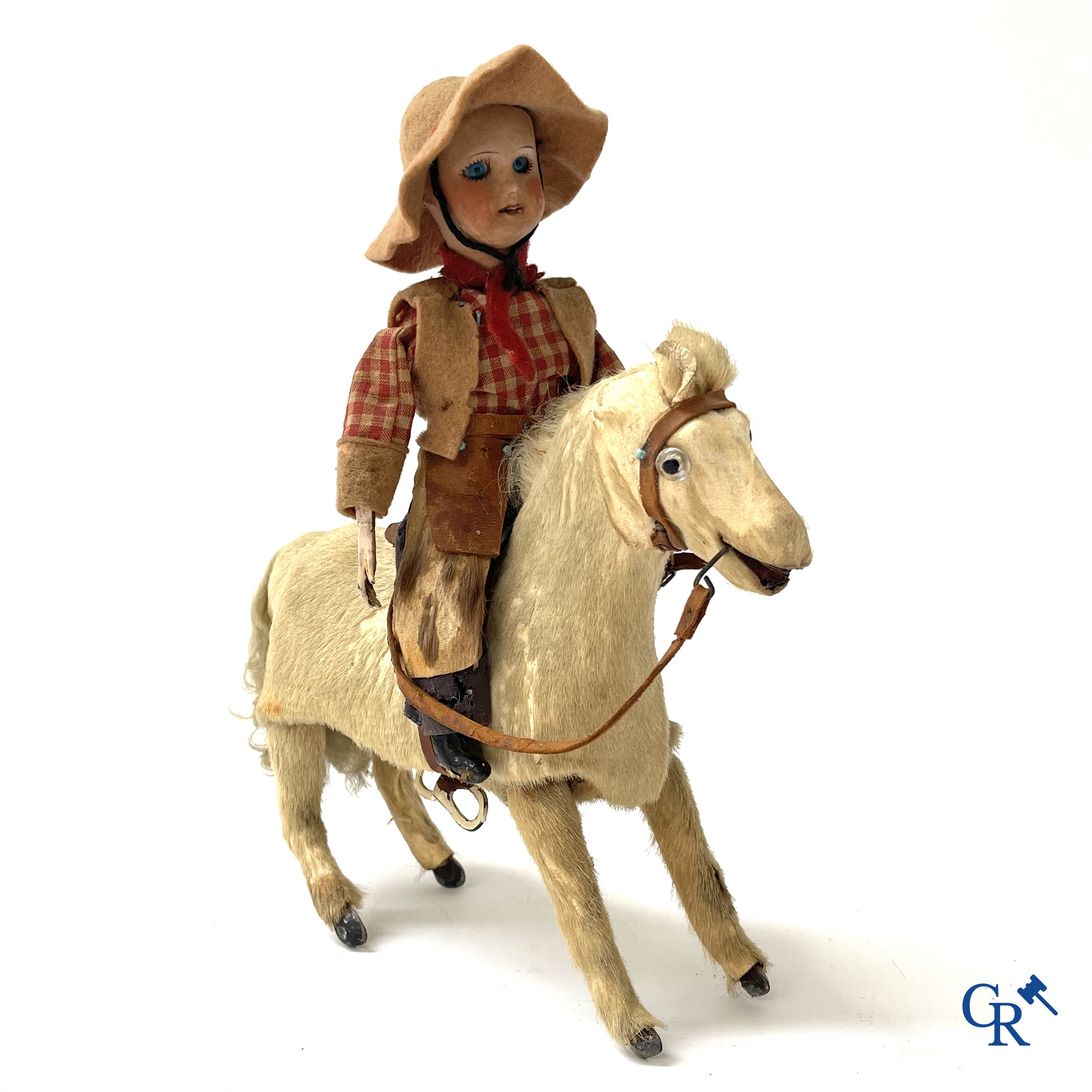 Oud speelgoed. Roullet & Decamps. "Cheval sauteur cowboy" Mechanisch speelgoedpaardje met cowboy. Circa 1910-1920.