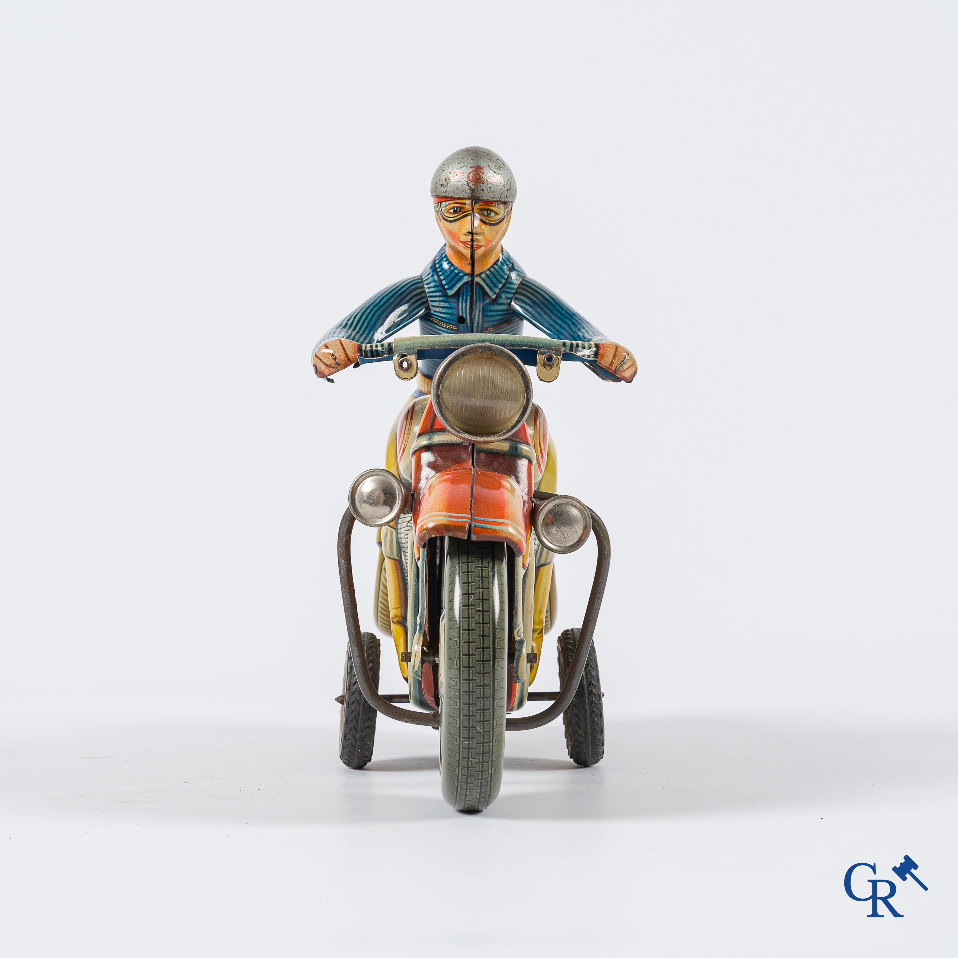 Oud speelgoed. Tipco, Western Germany. Motorfiets in beschilderd blik. Jaren '50.