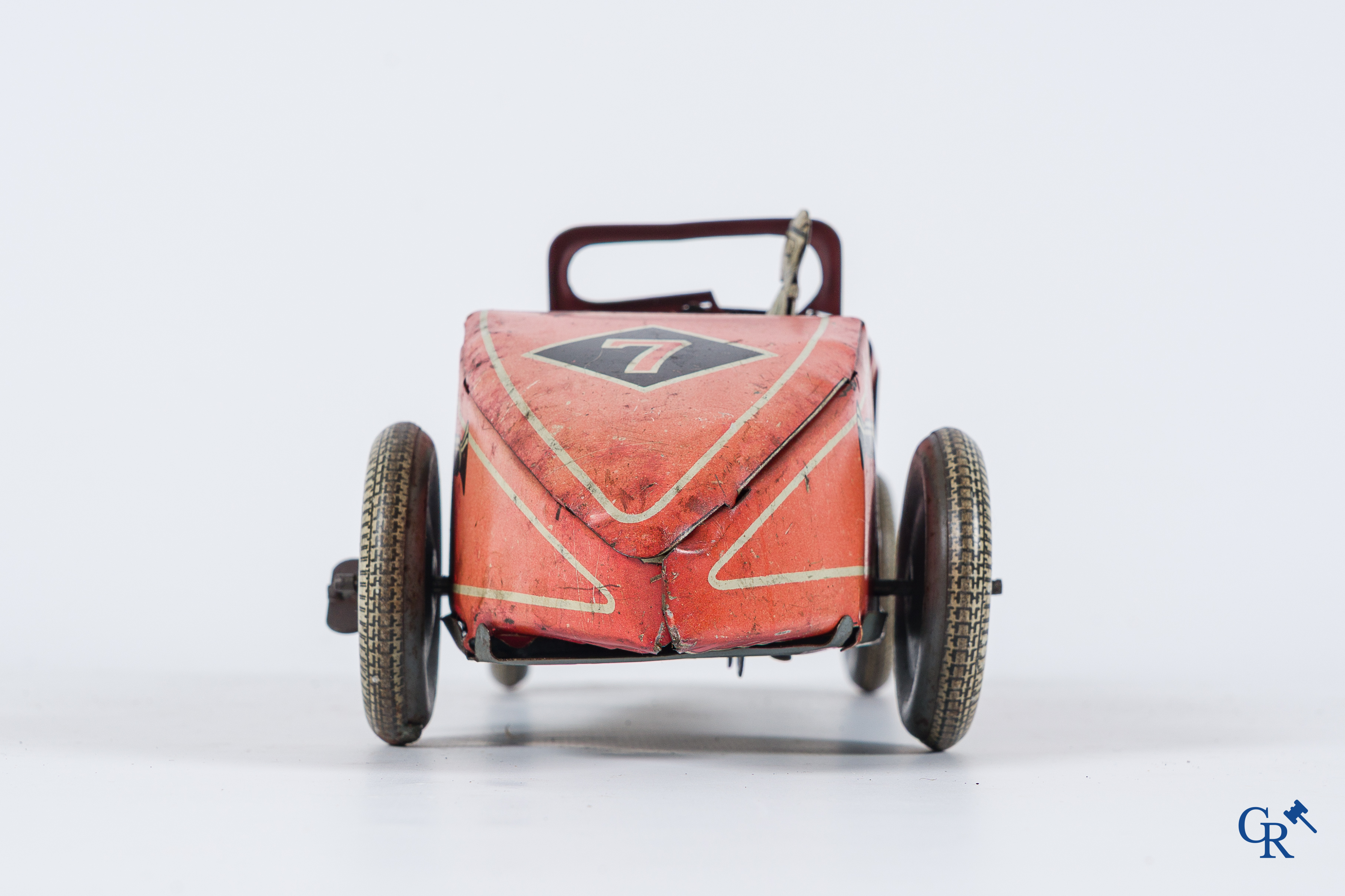 Oud speelgoed. Made in England. Racewagen met autopiloot. Blik met opwindmechanisme. Jaren '30-'40.