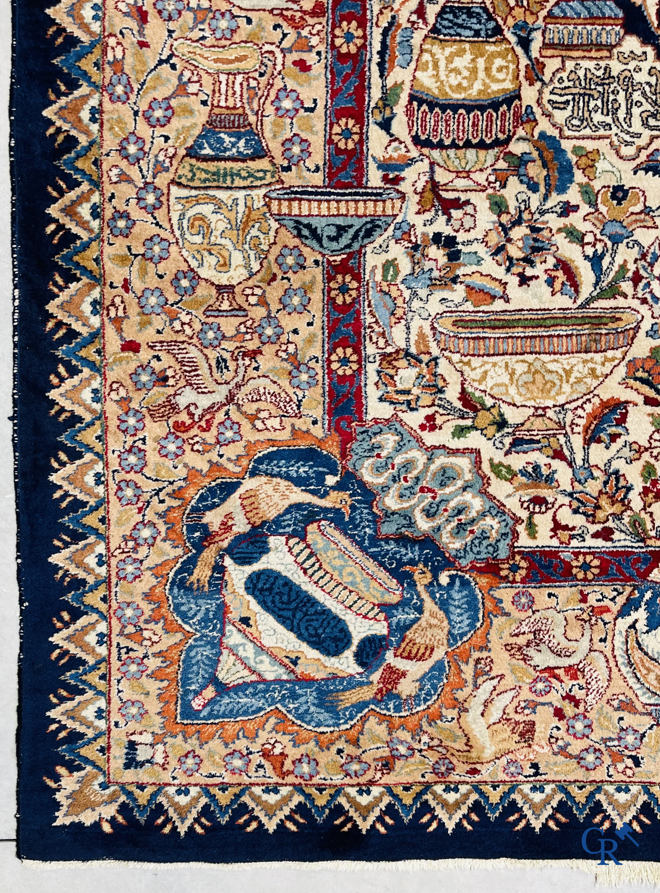 Oriental carpets: A large hand-knotted oriental carpet with antique decor. Multiple inscriptions.