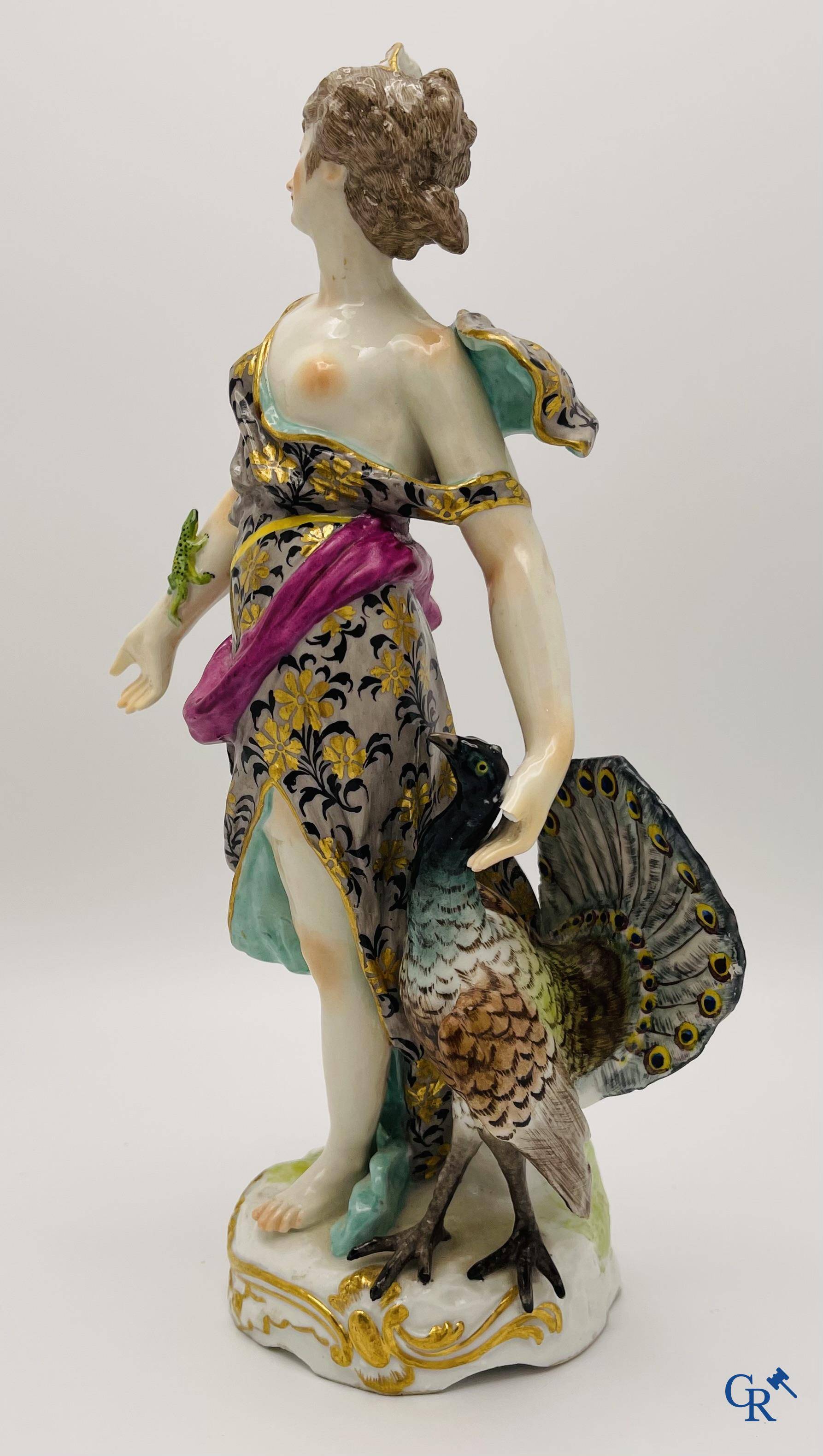 A pair of polychrome porcelain figures in the manner of Meissen.