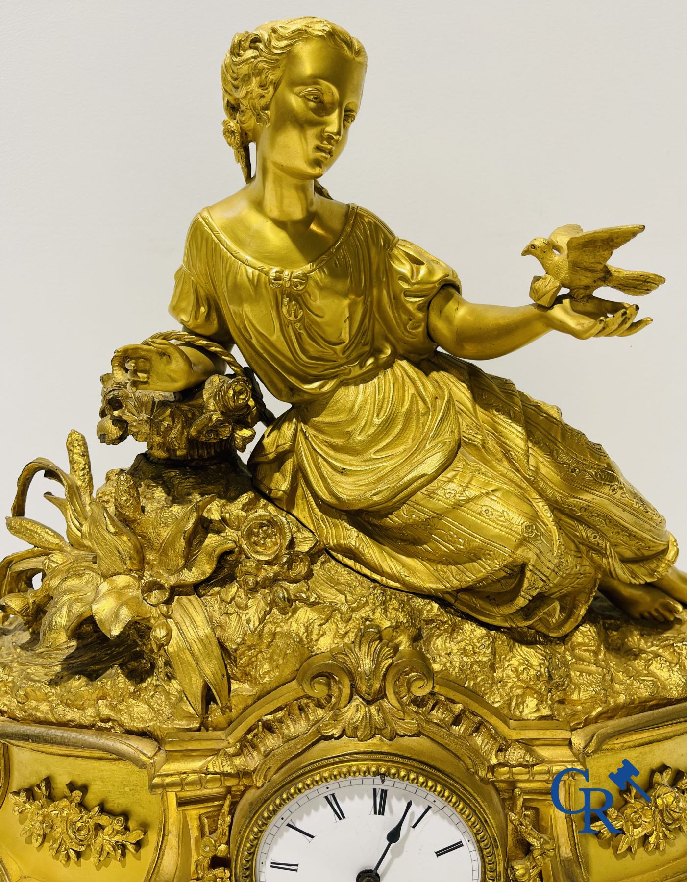 Bronze gilded clock with a romantic performance. 19th century.