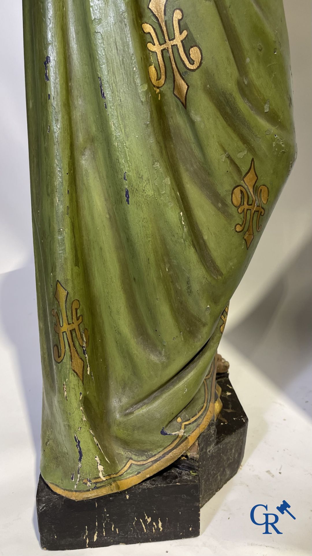 A 19th century wooden statue of Christ and a wooden display case with plaster representation of Mary with child.