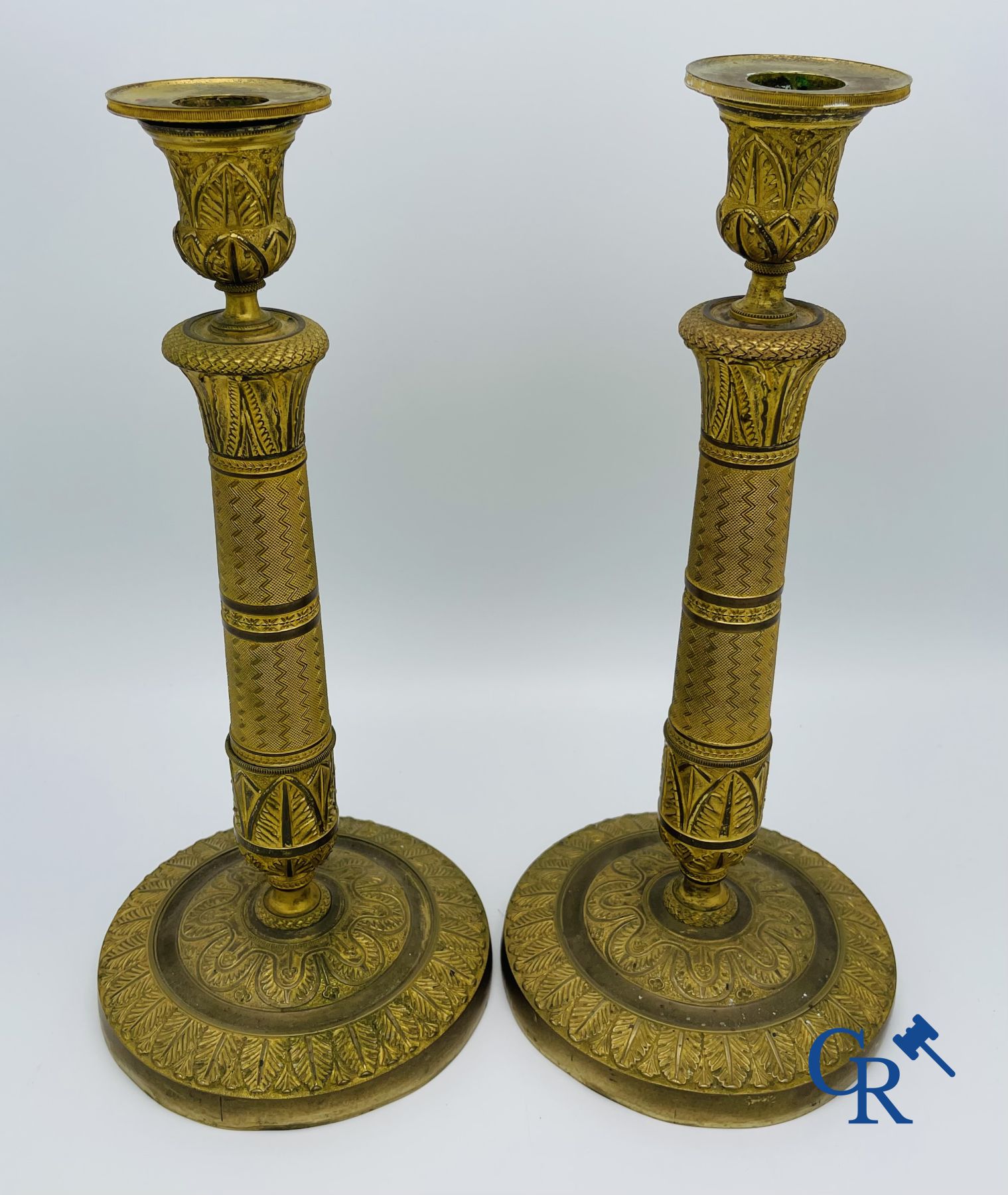 Pair of Charles X candlesticks in gilded bronze.