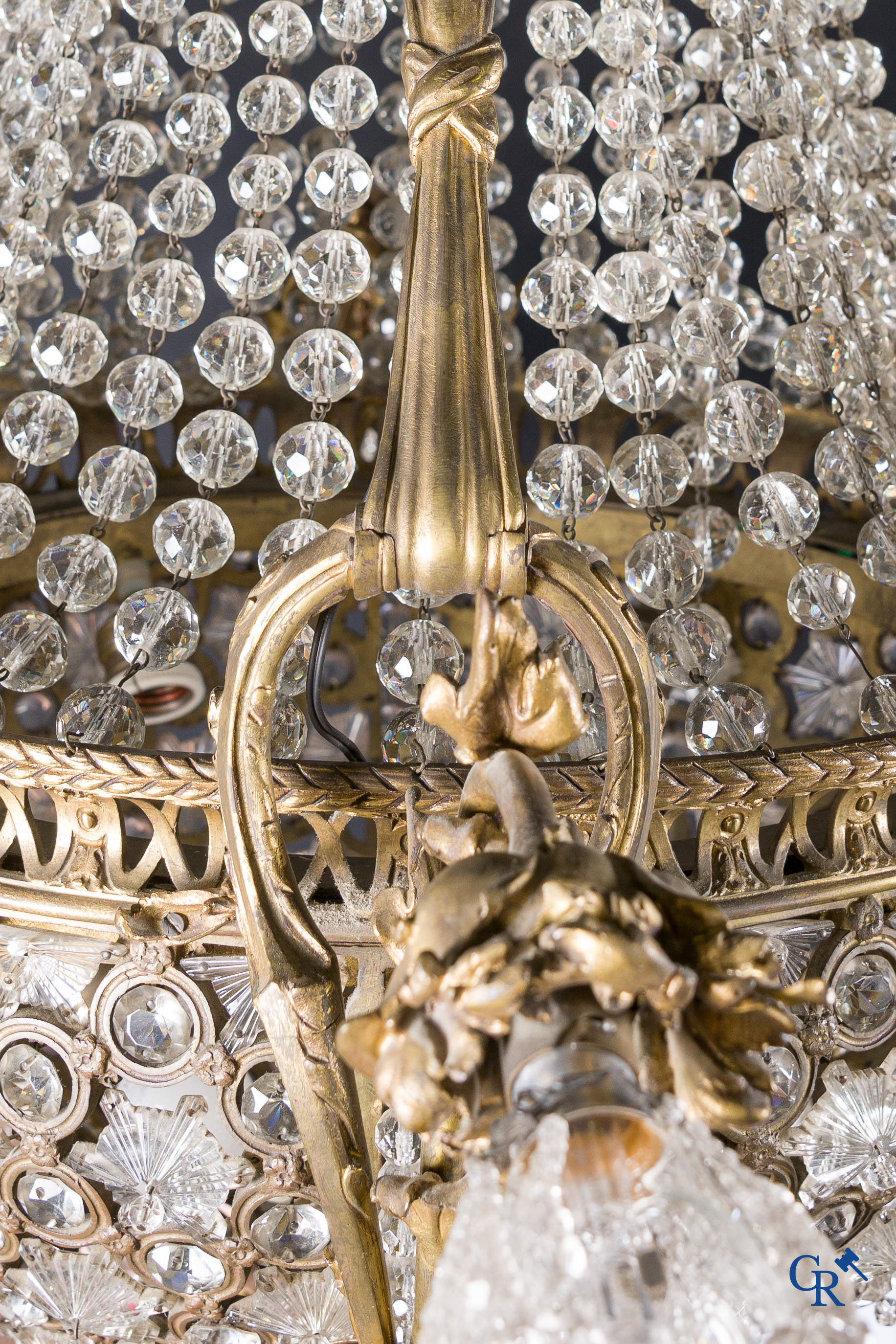 An imposing bronze and crystal chandelier in LXVI style. Circa 1920.