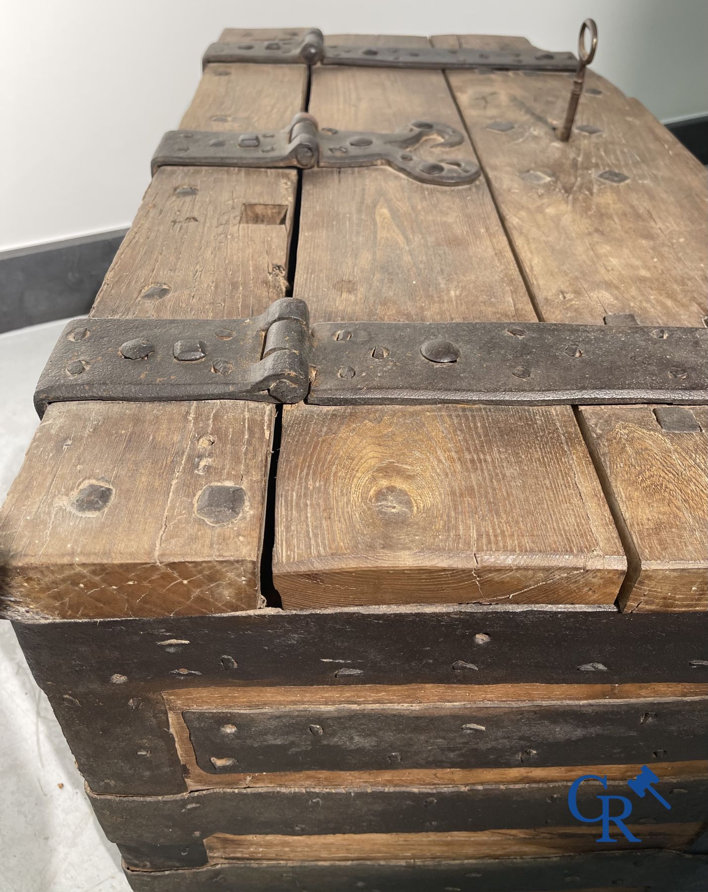 Antique wooden chest with hardware and lockwork in forging.