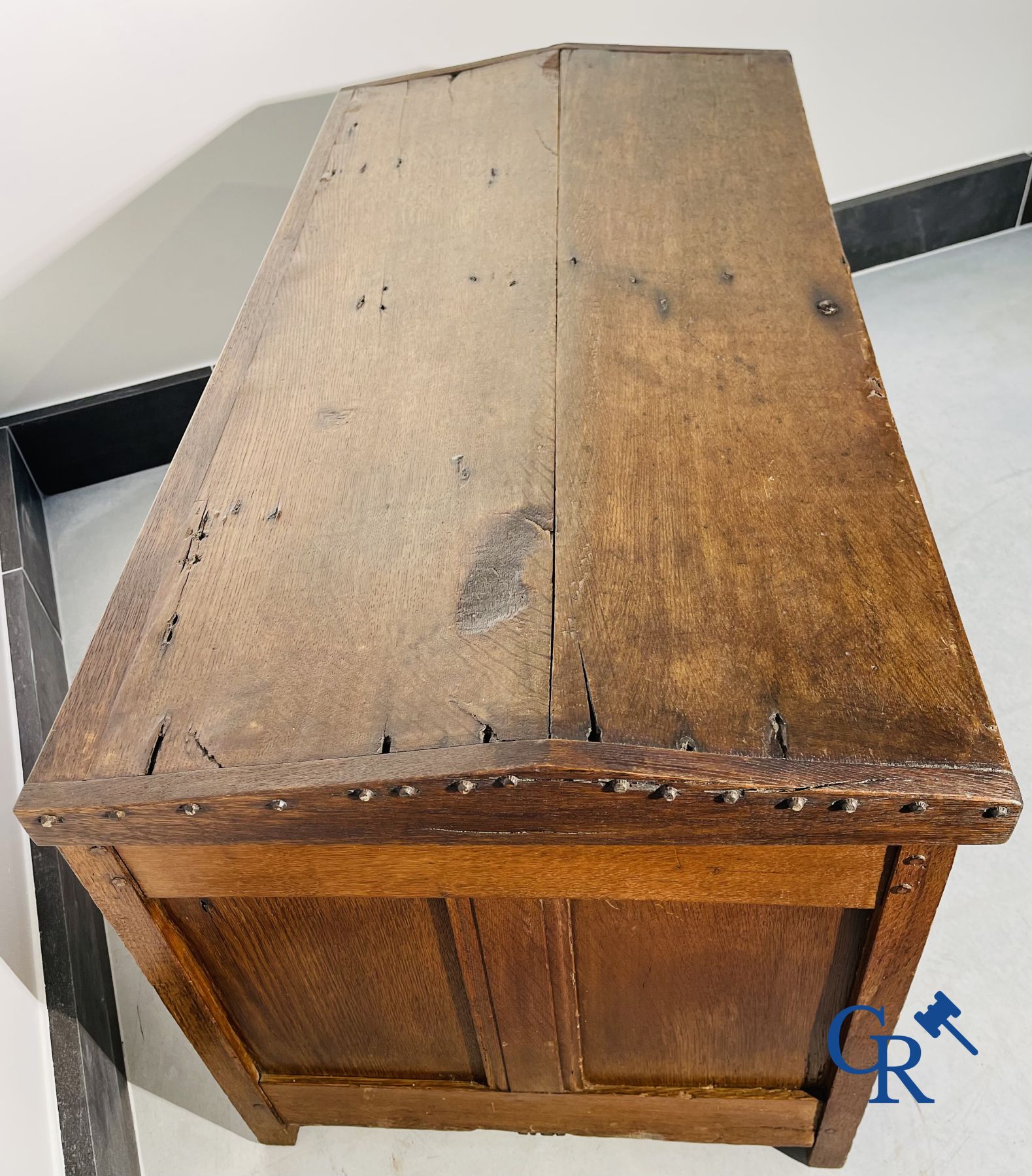 2 oak chests and an antique cast iron fireplace plate.