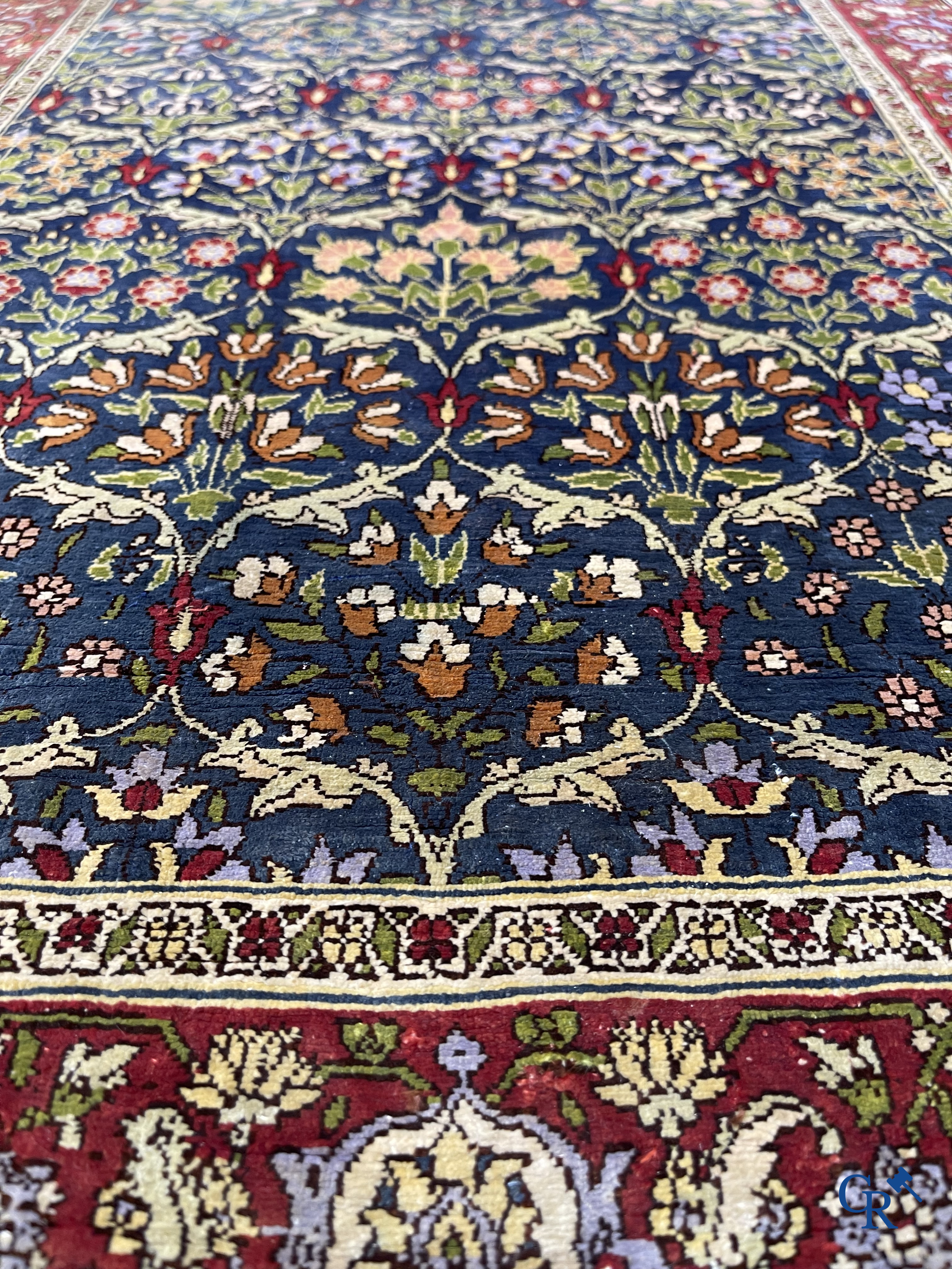 Oriental carpets, a finely hand-knotted silk carpet with floral decor.