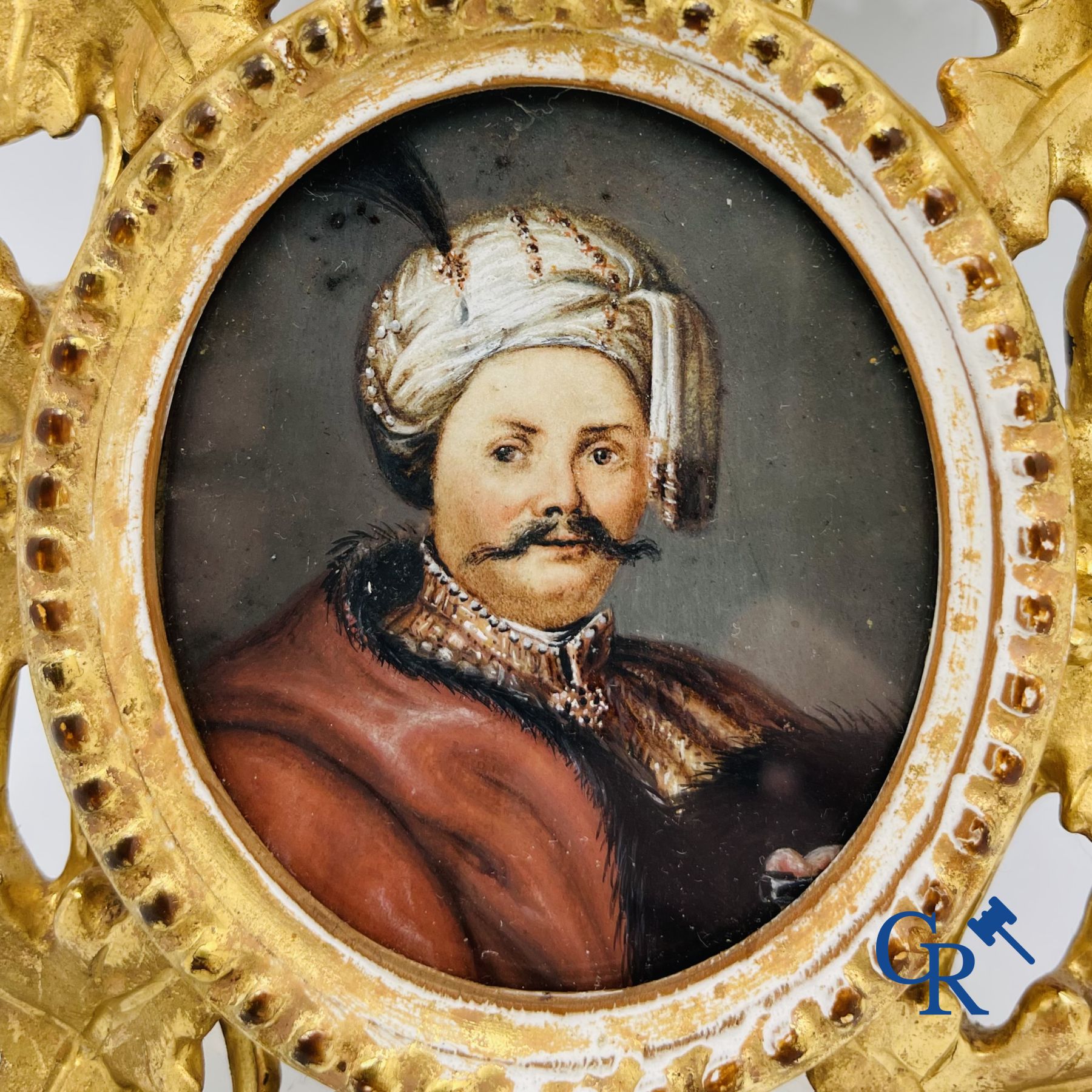 Miniature portrait in a gilded wood-carved frame. 19th century.