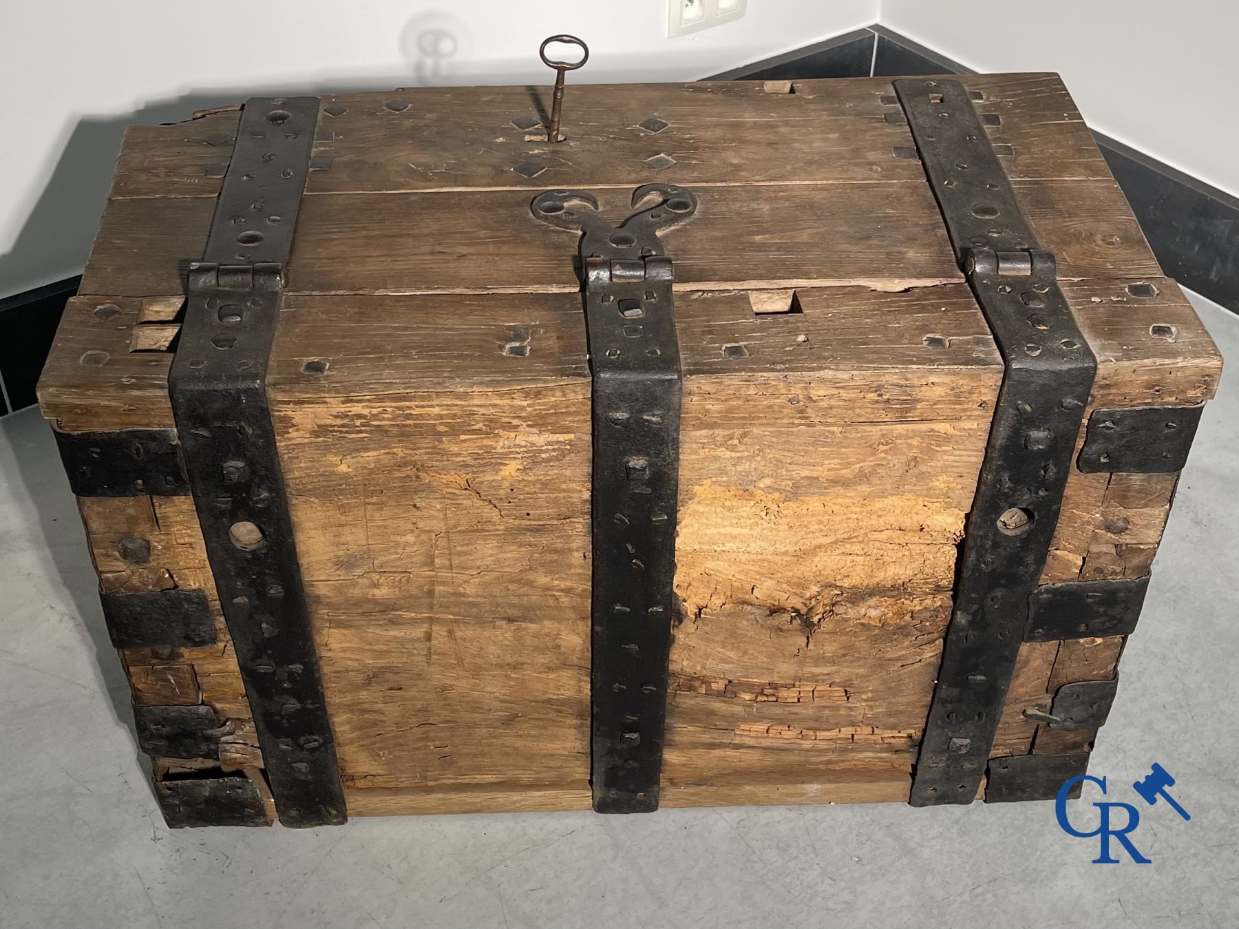 Antique wooden chest with hardware and lockwork in forging.