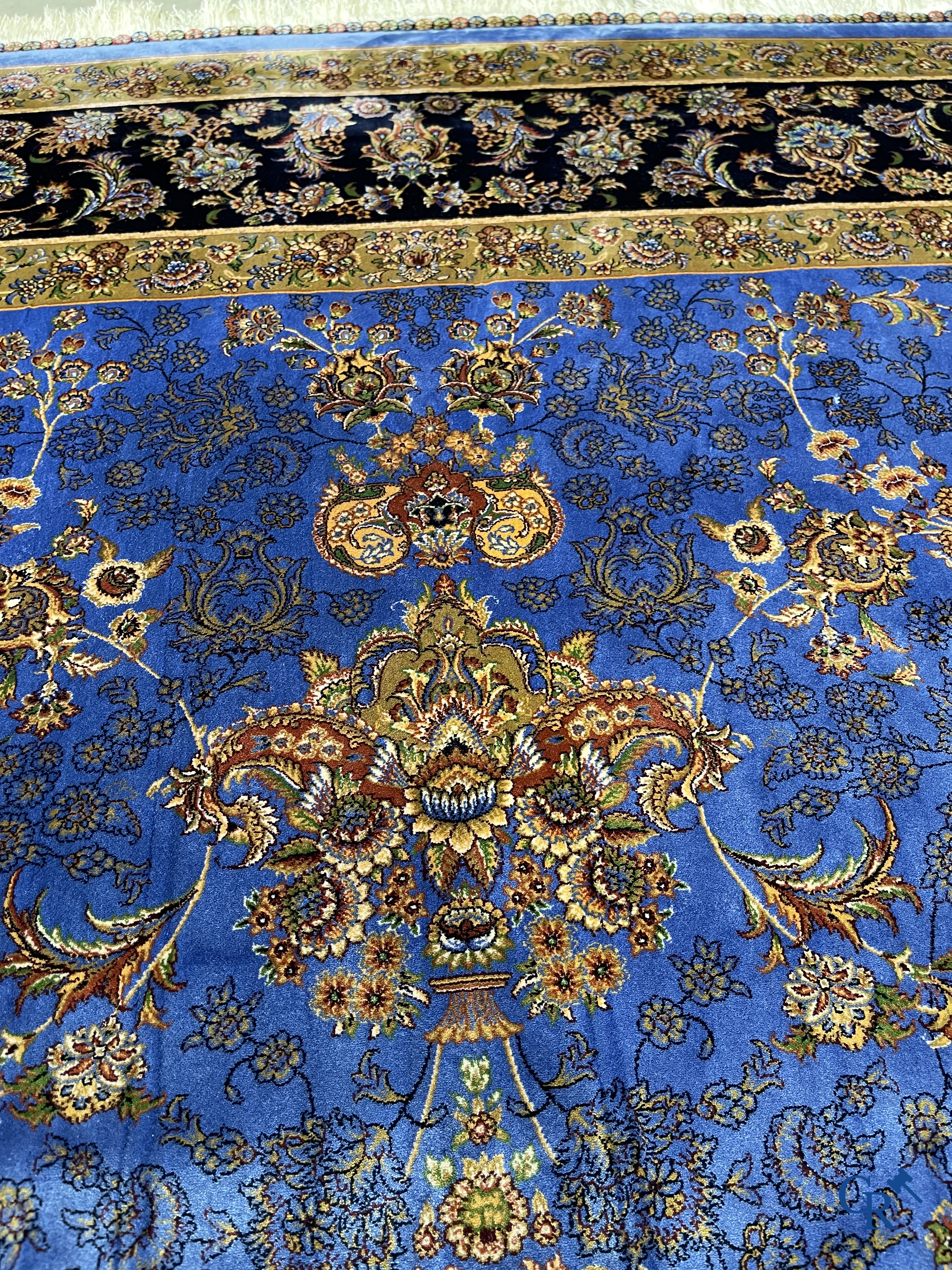 Carpets. Exceptional silk carpet with floral decor on a blue background.