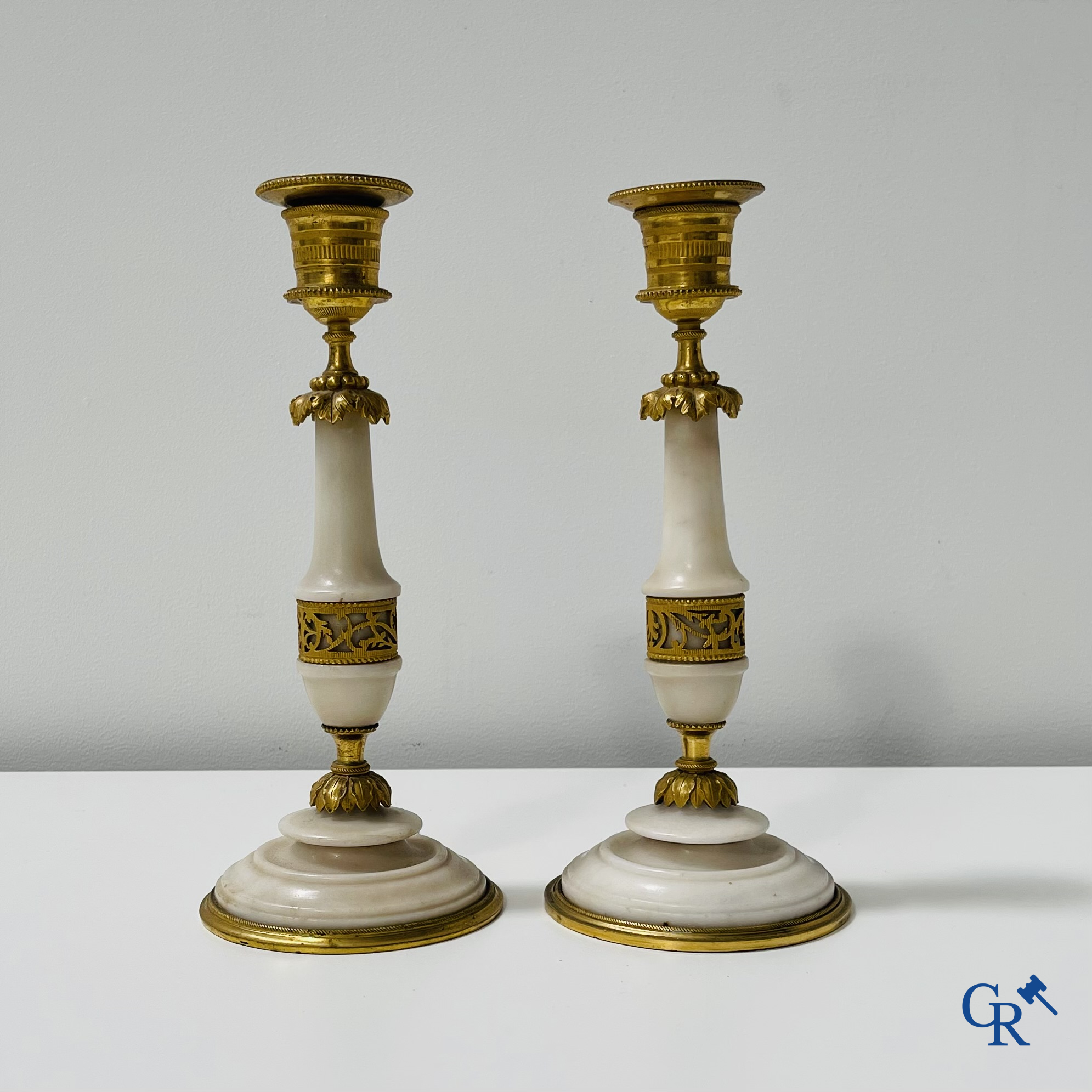 A pair of candlesticks in LXVI style.