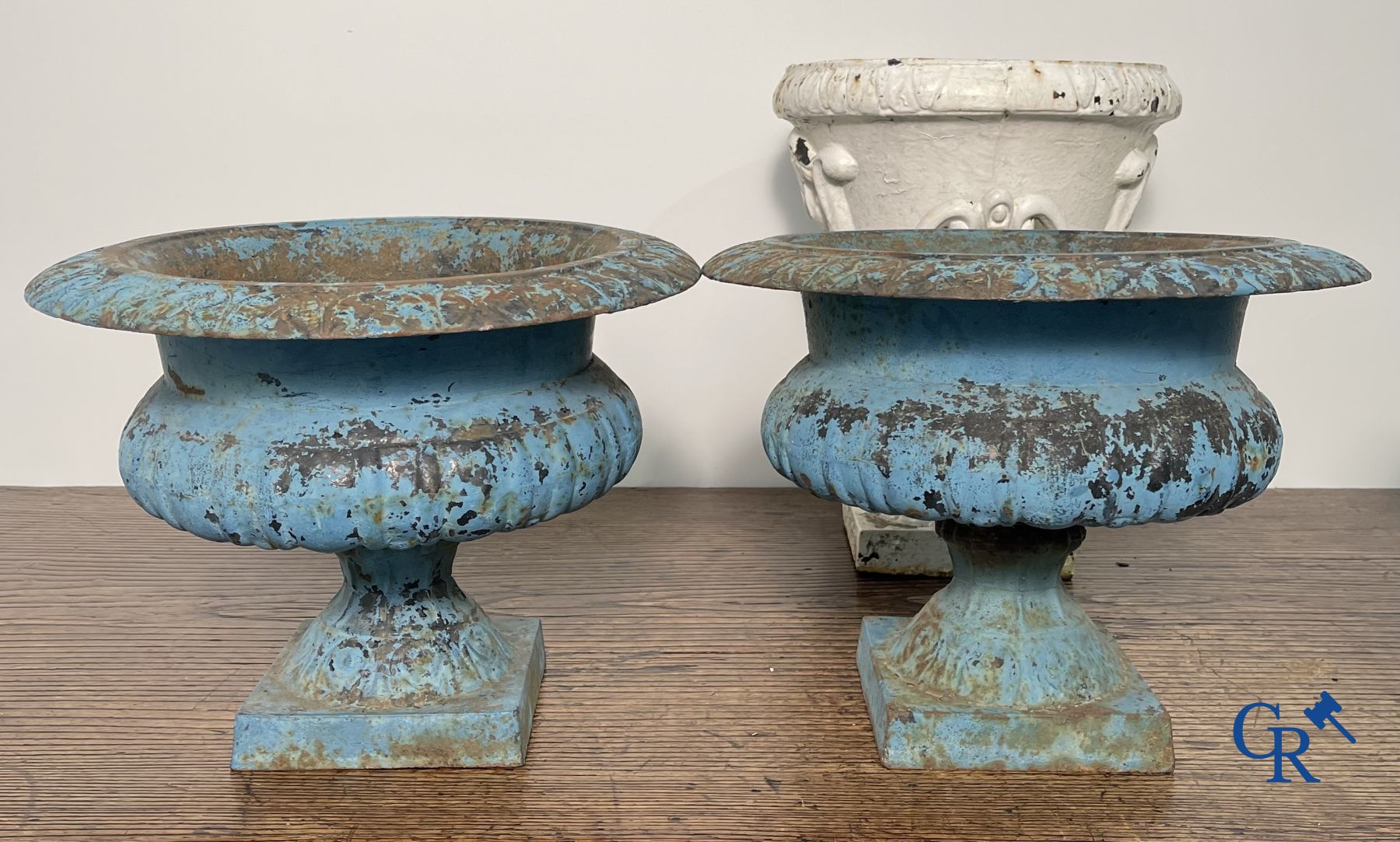 4 cast iron garden vases.