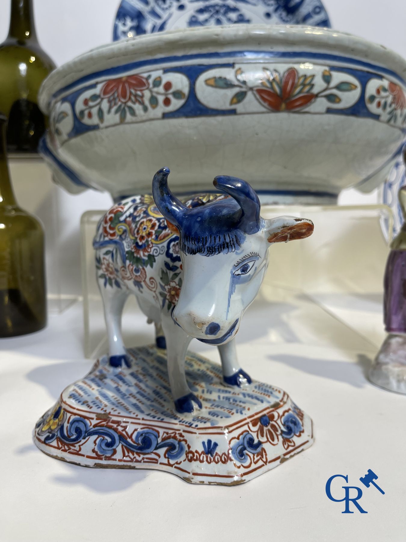 A part of a North French fountain and various pieces in faience and various antiques.