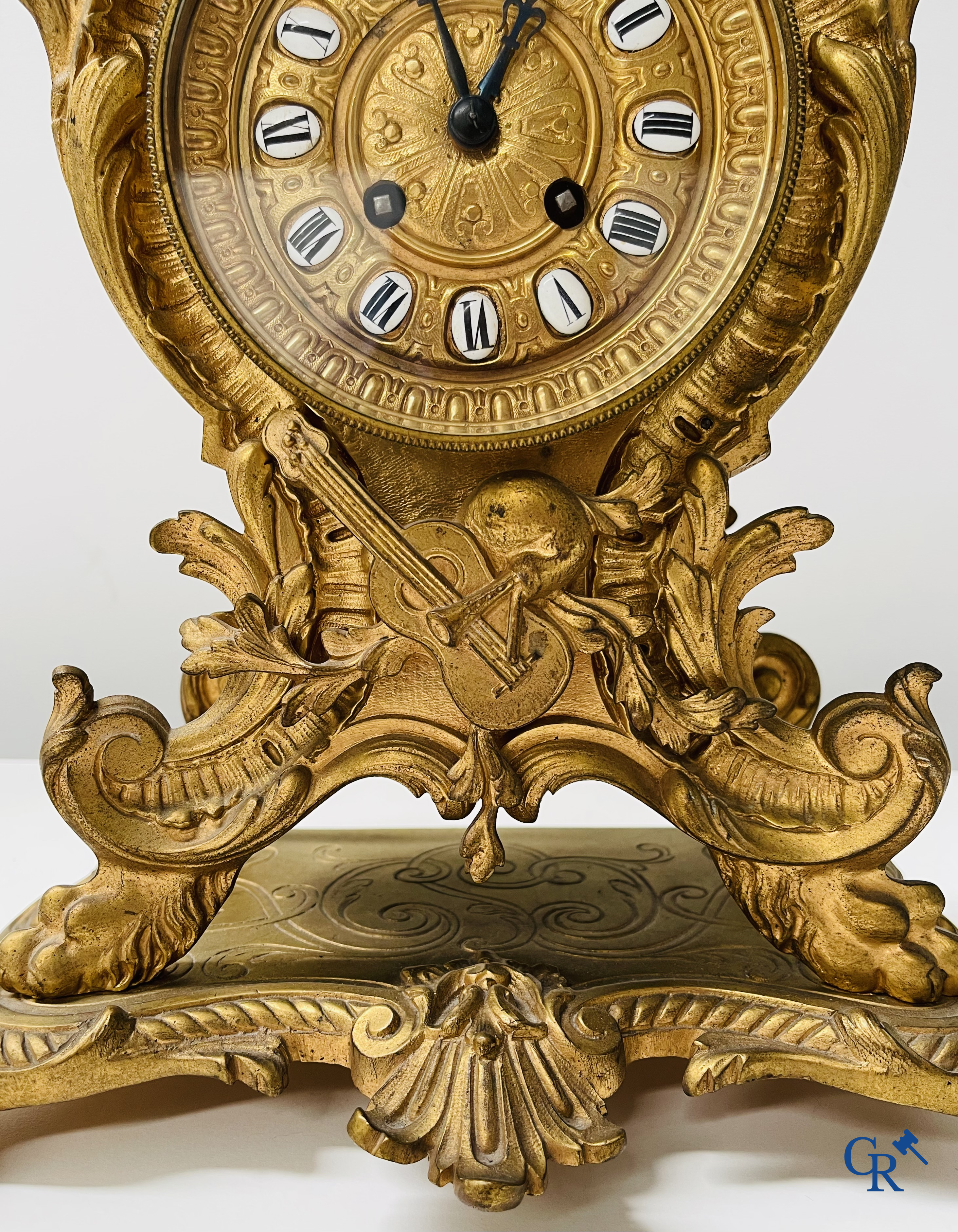 3-piece clock set in gilded bronze. Bronze dial with enamelled Roman numerals. LXV style. Period 1900.