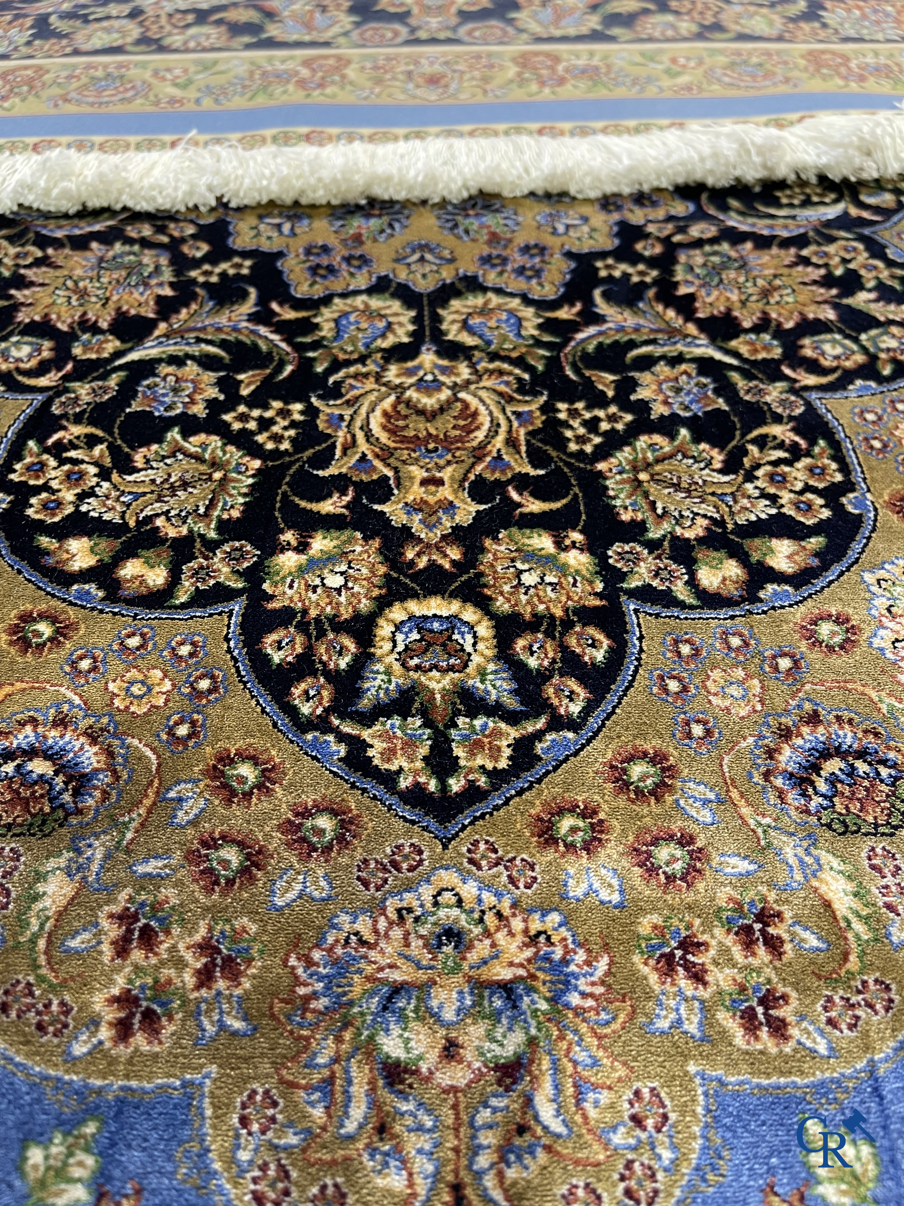 Carpets. Exceptional silk carpet with floral decor on a blue background.