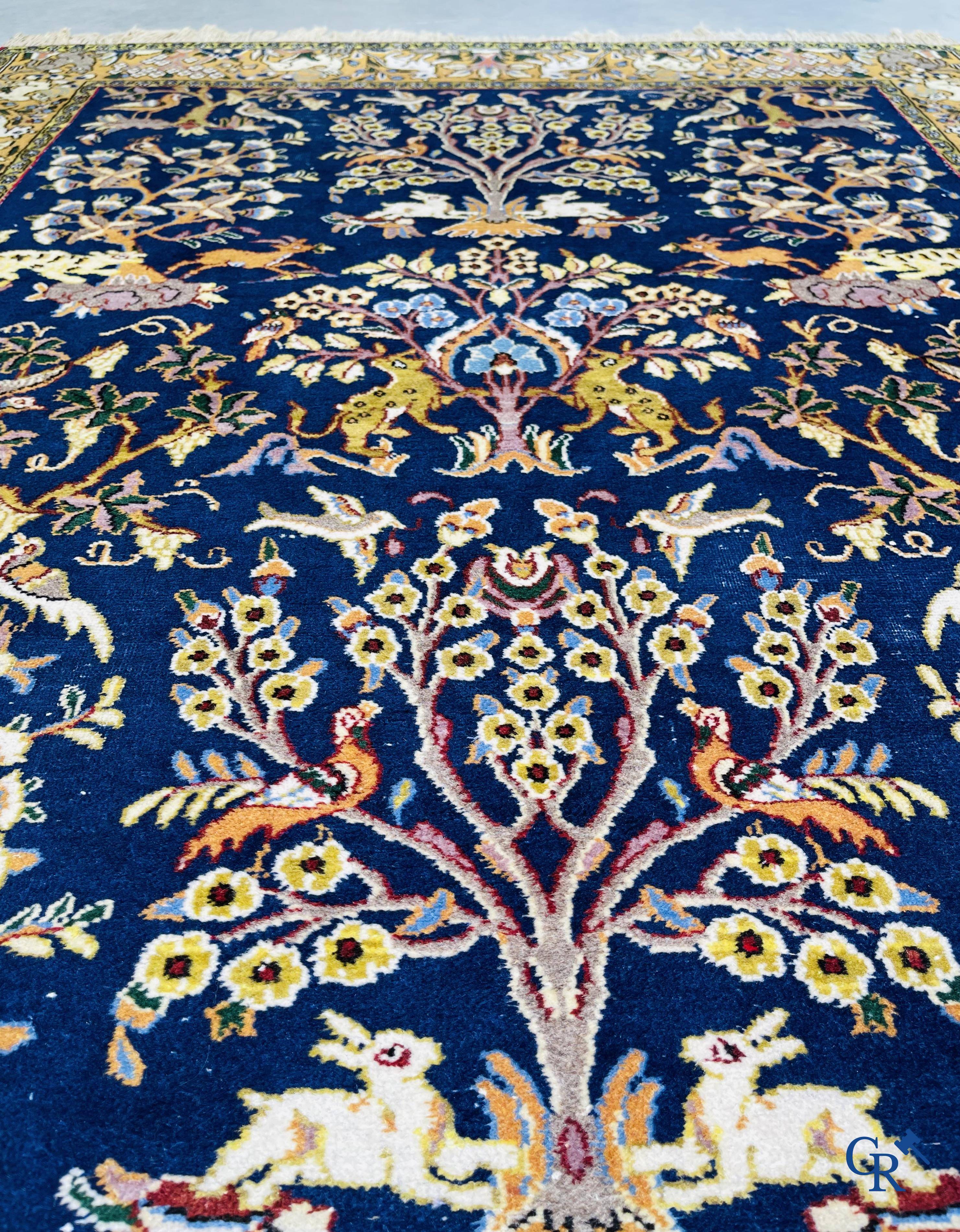 Oriental carpets: Iran, hand-knotted Persian carpet with decor of forest animals.