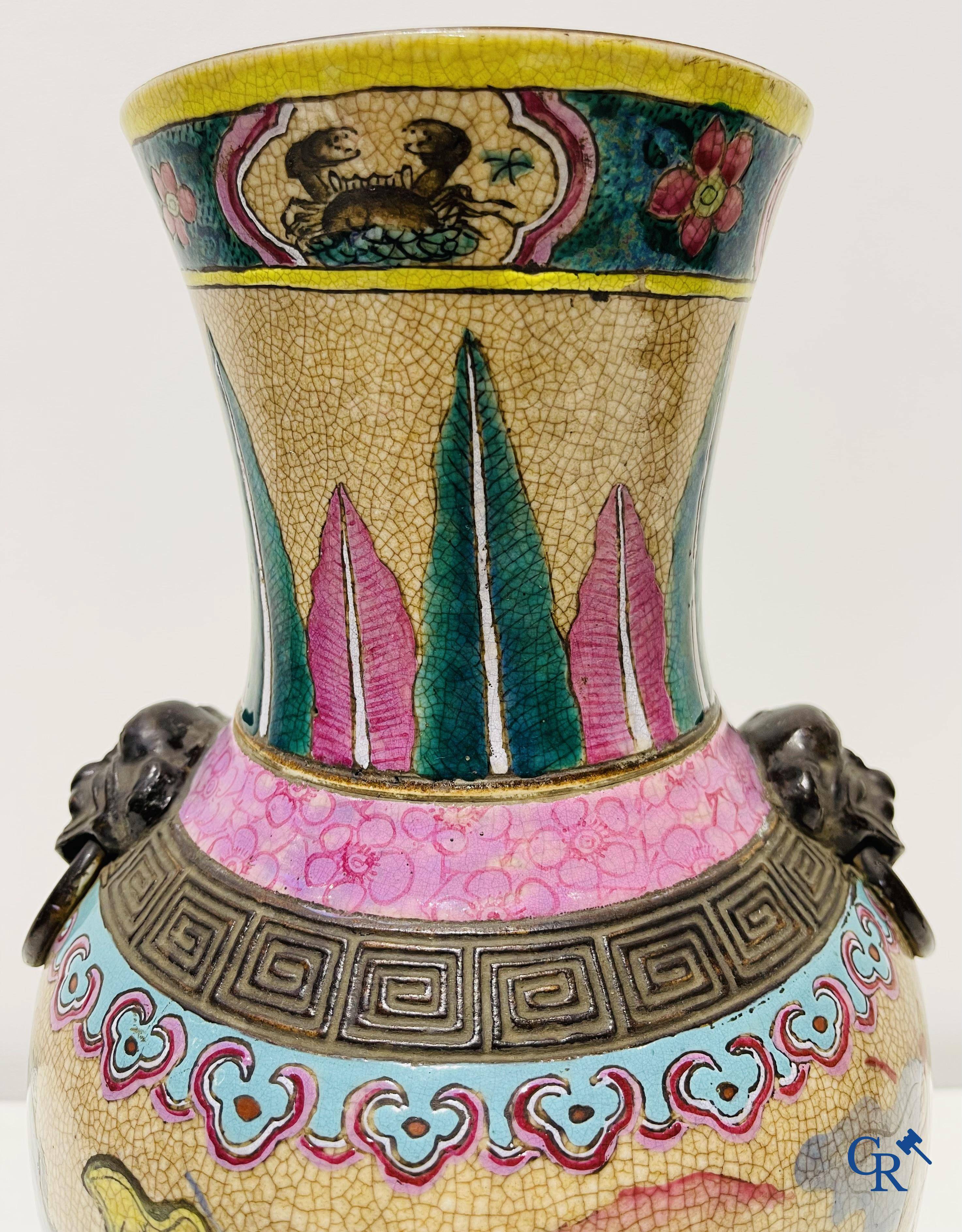 Asian art: A Chinese Nanking famille rose crackle vase with warrior decor. 19th century.