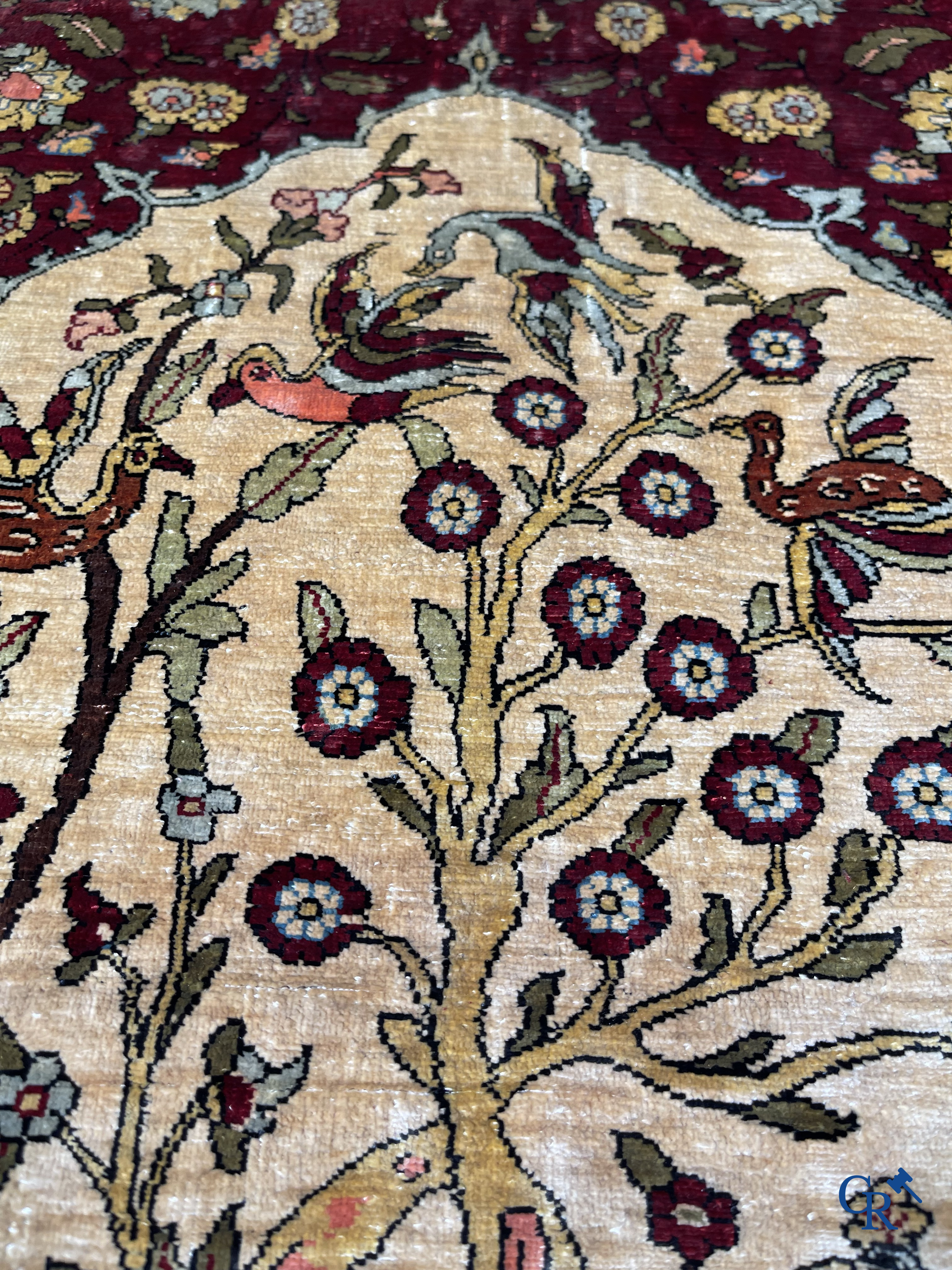 Oriental carpets, Hereke, a finely hand-knotted and signed silk carpet with a tree of life.