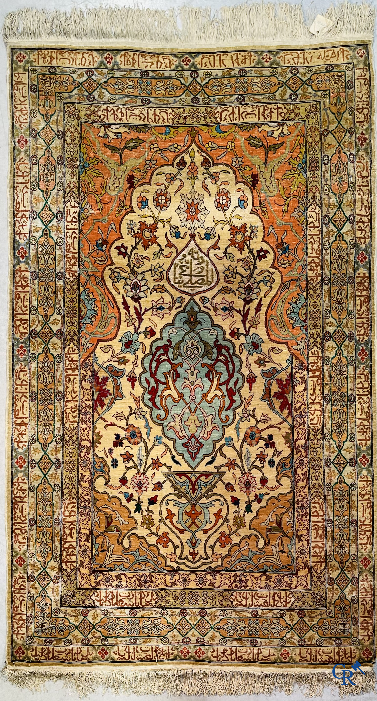 Oriental carpets, Hereke Turkey, a finely hand-knotted silk carpet with inscriptions and gold thread.