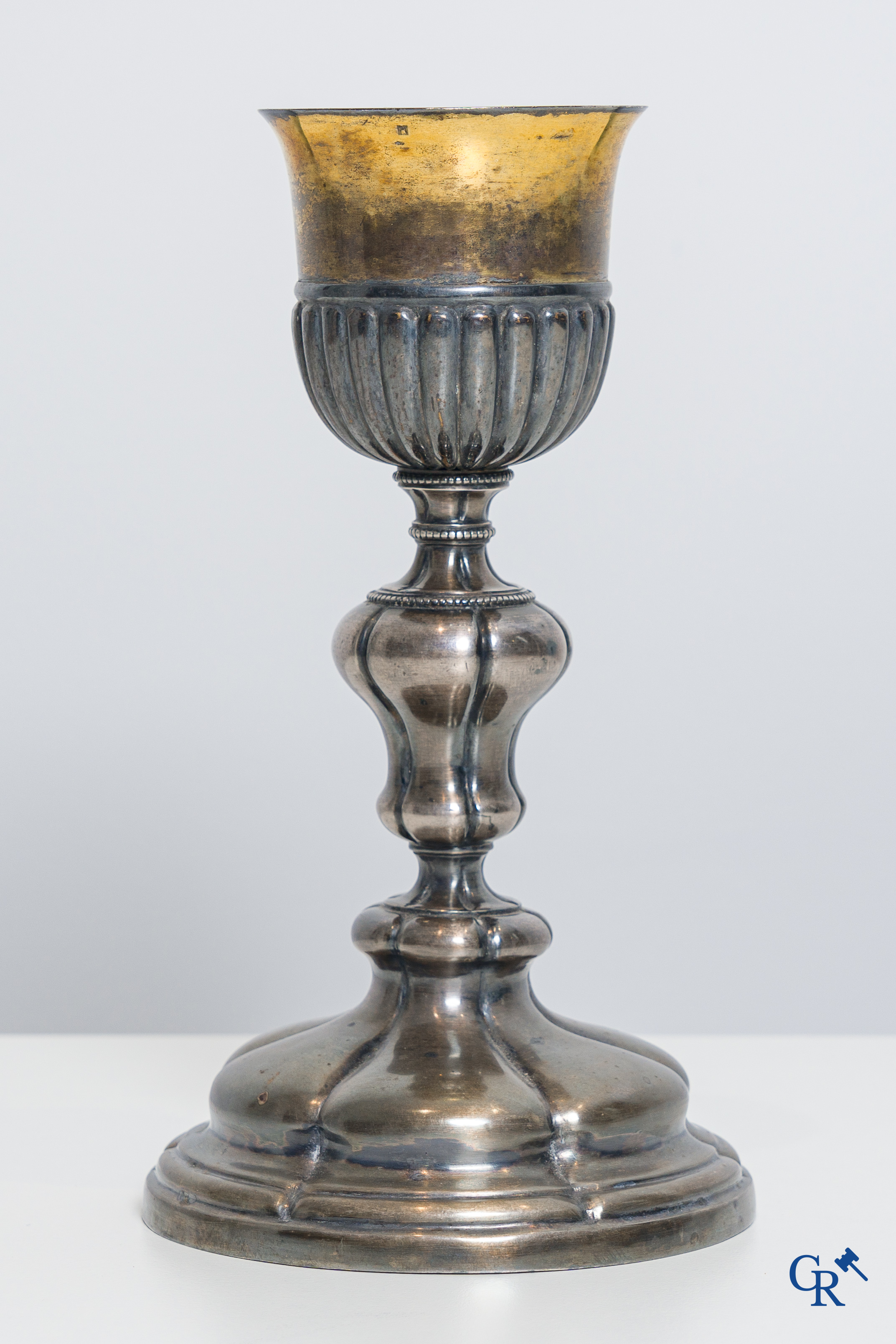 Religious objects. A silver- and gold plated chalice with Memento Donatoris inscriptions.