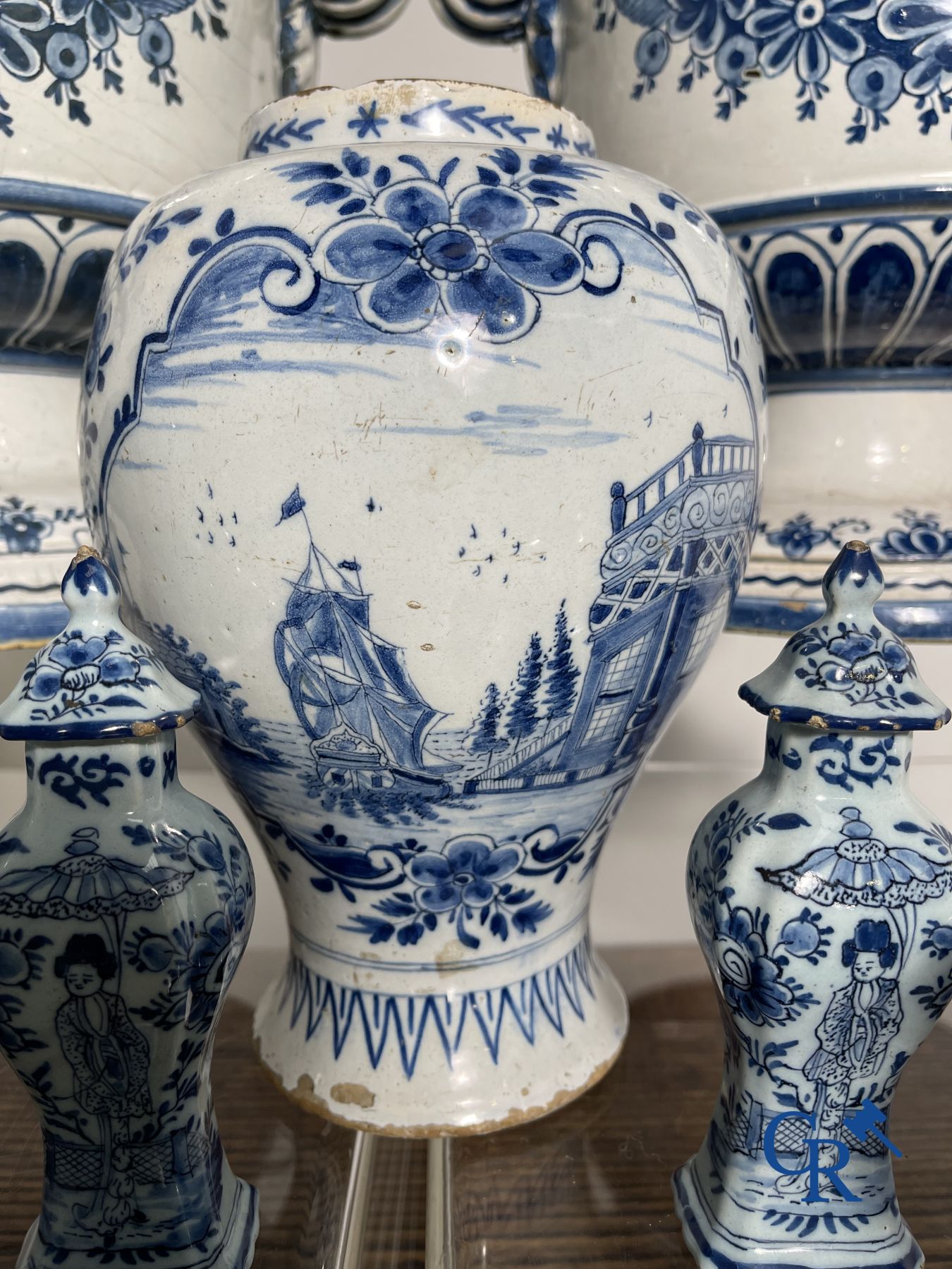 Delft: 11 pieces of blue and white faience with different décors. 17th - 18th century.