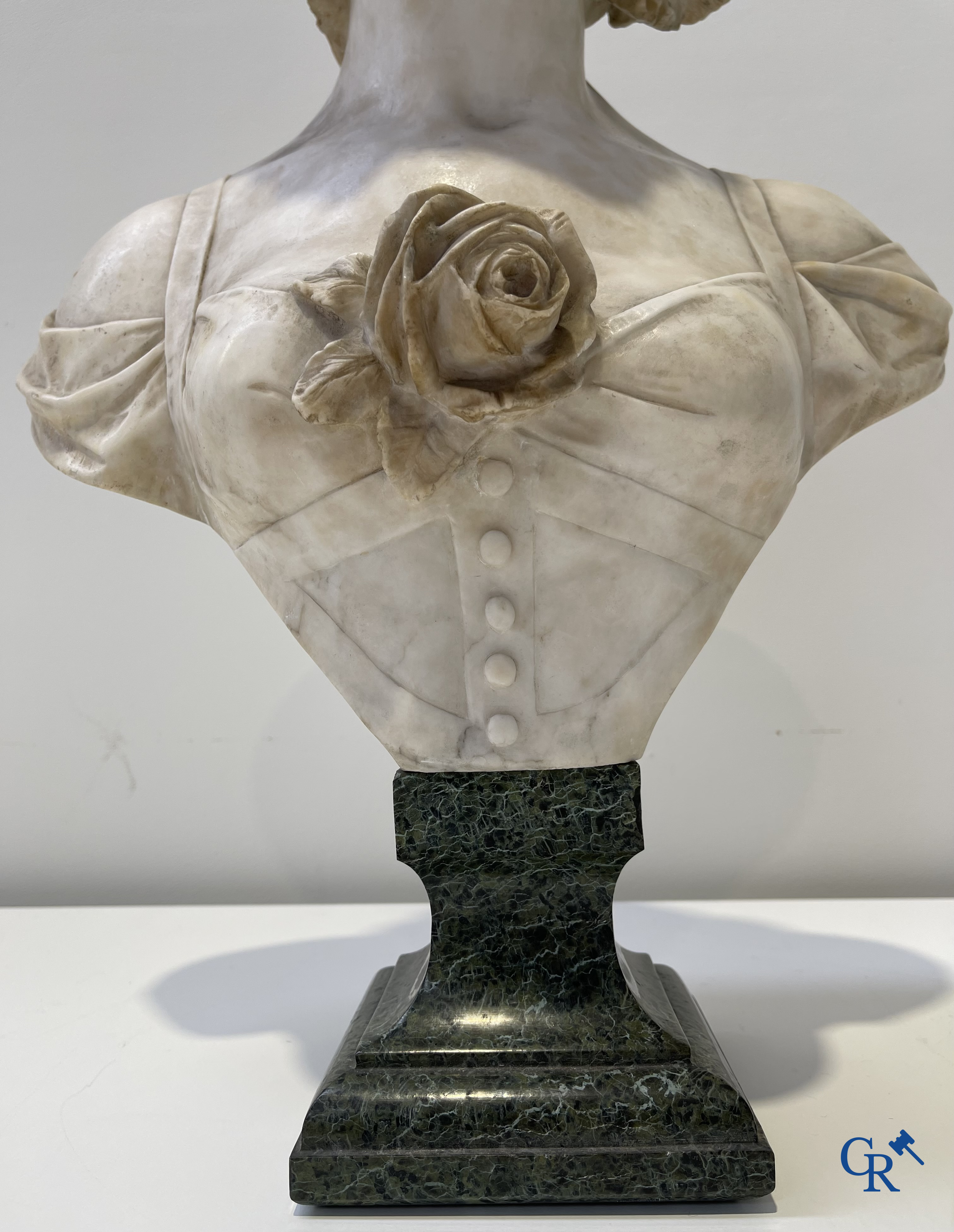 A. Cipriani. An imposing bust in marble on a green veined marble pedestal. Art Deco period.