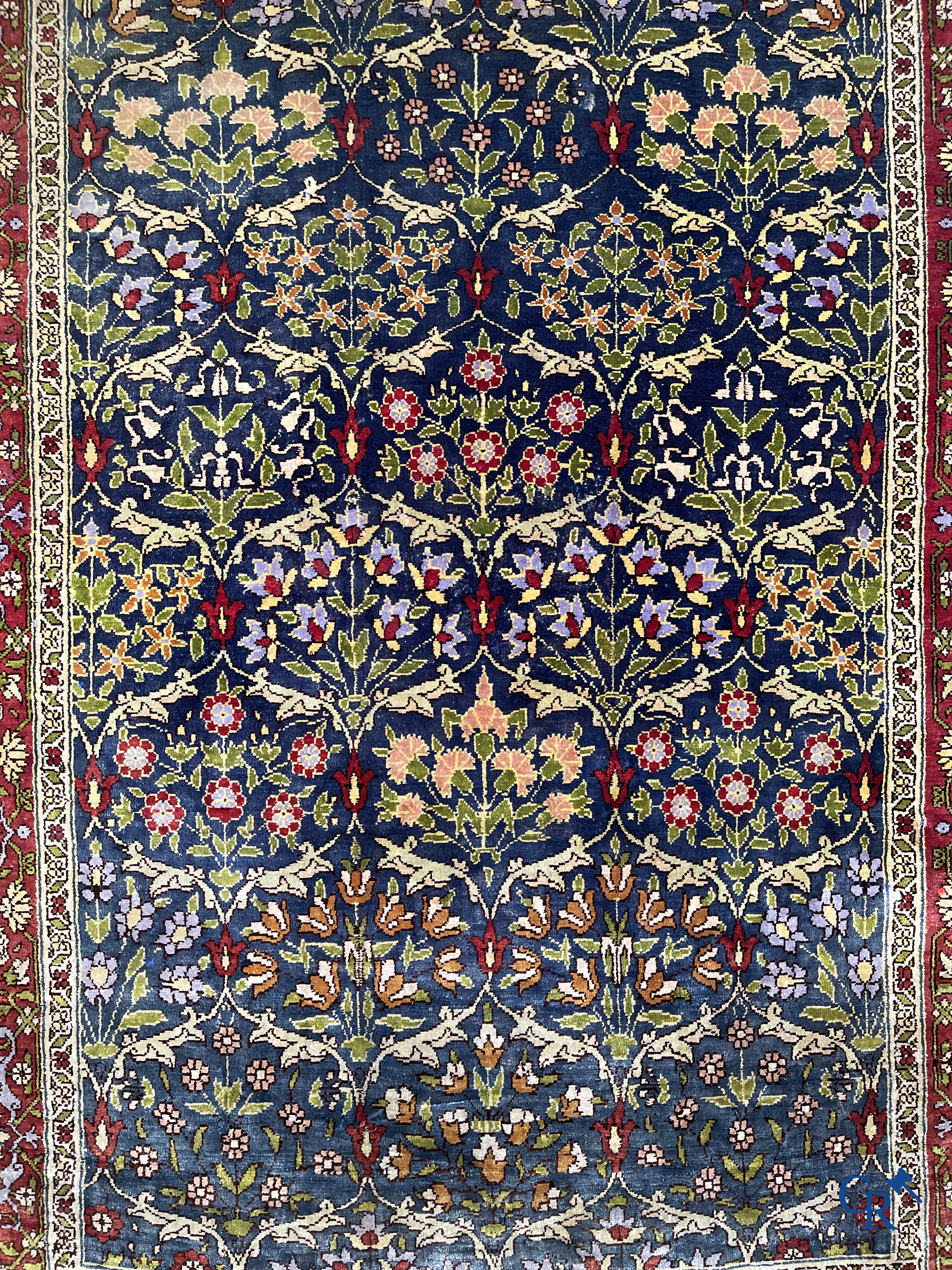 Oriental carpets, a finely hand-knotted silk carpet with floral decor.