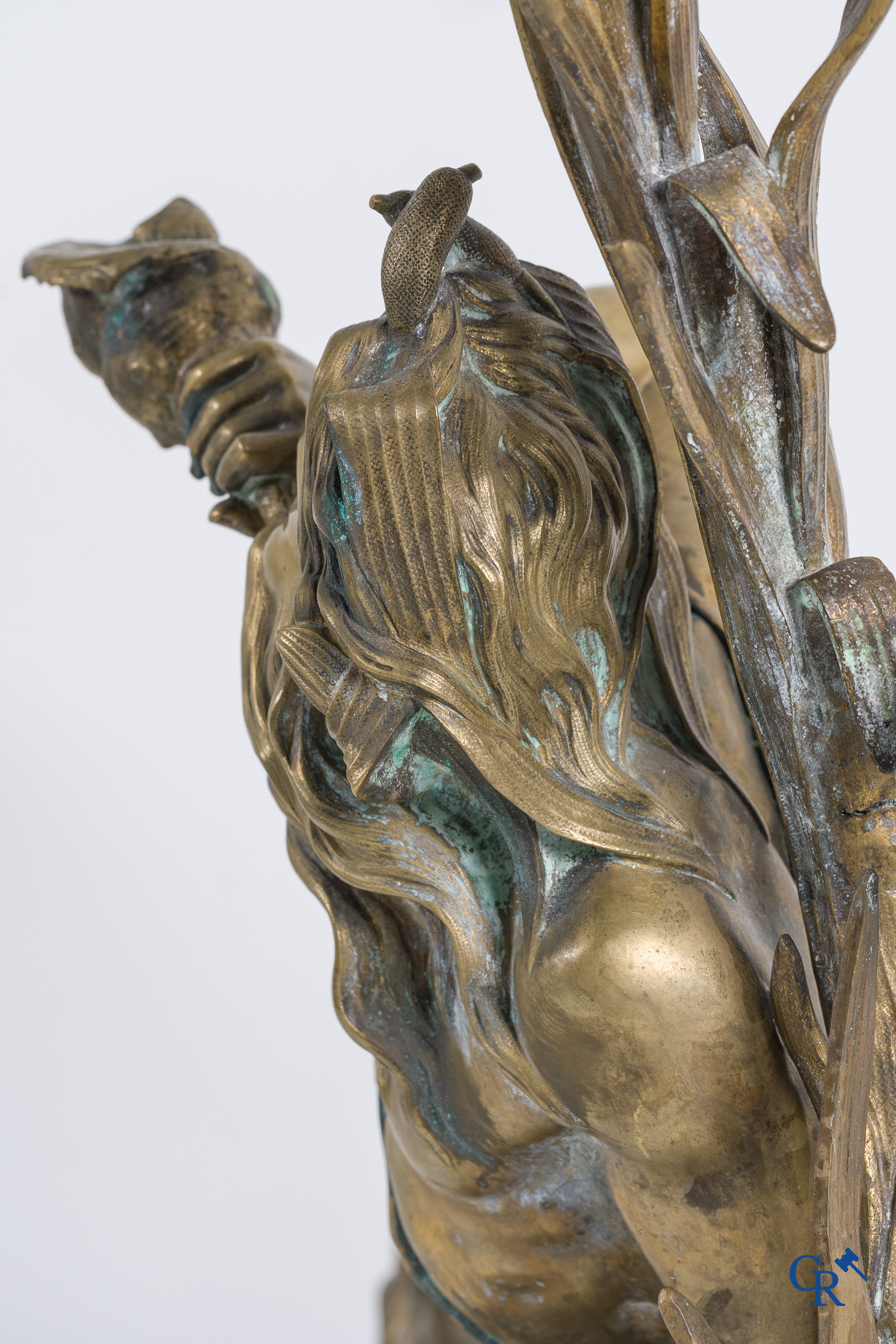 A large pair of finely chiseled bronze chenets with Tritons. Louis XV style. Napoleon III period.