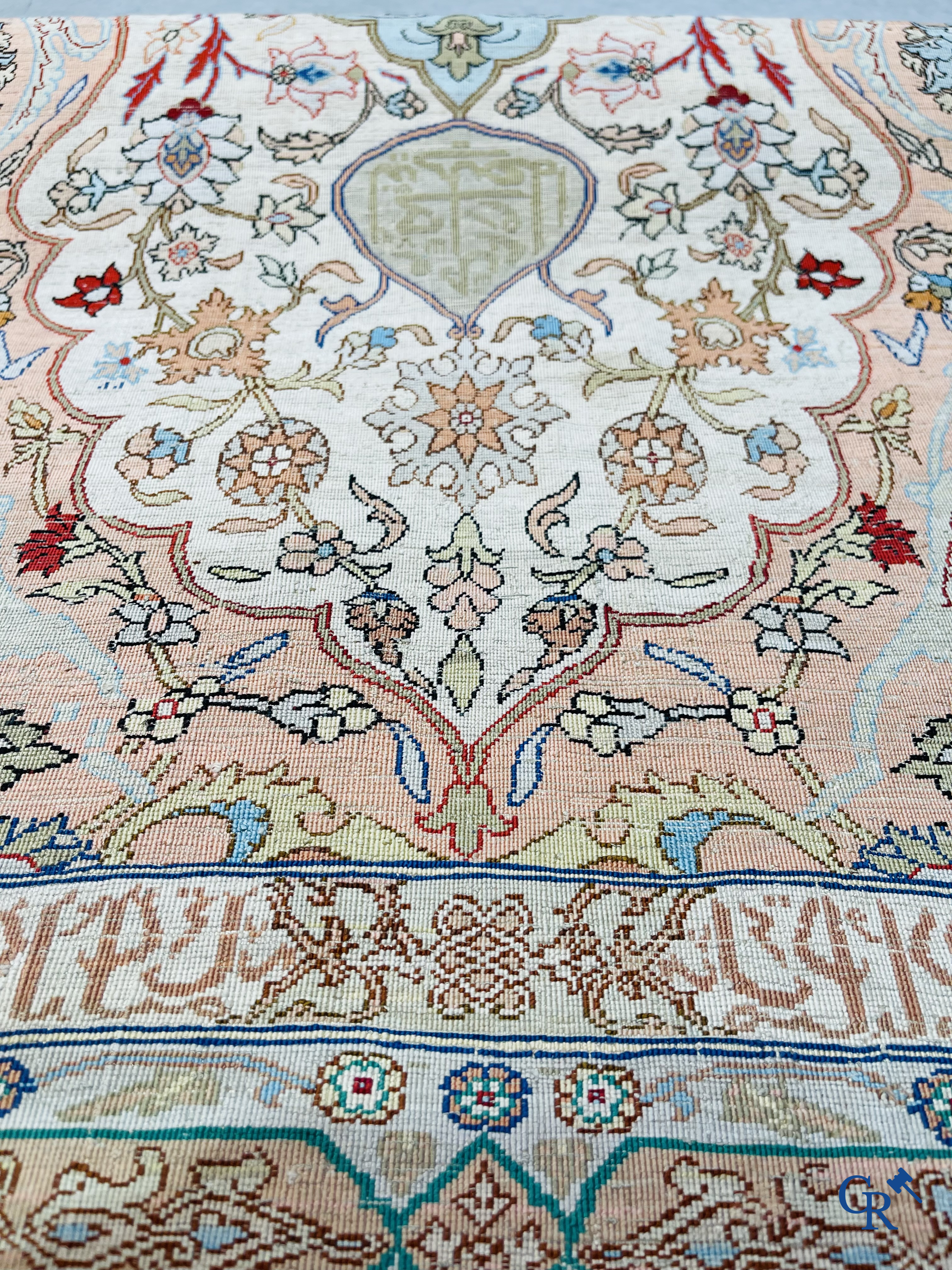 Oriental carpets, Hereke Turkey, a finely hand-knotted silk carpet with inscriptions and gold thread.