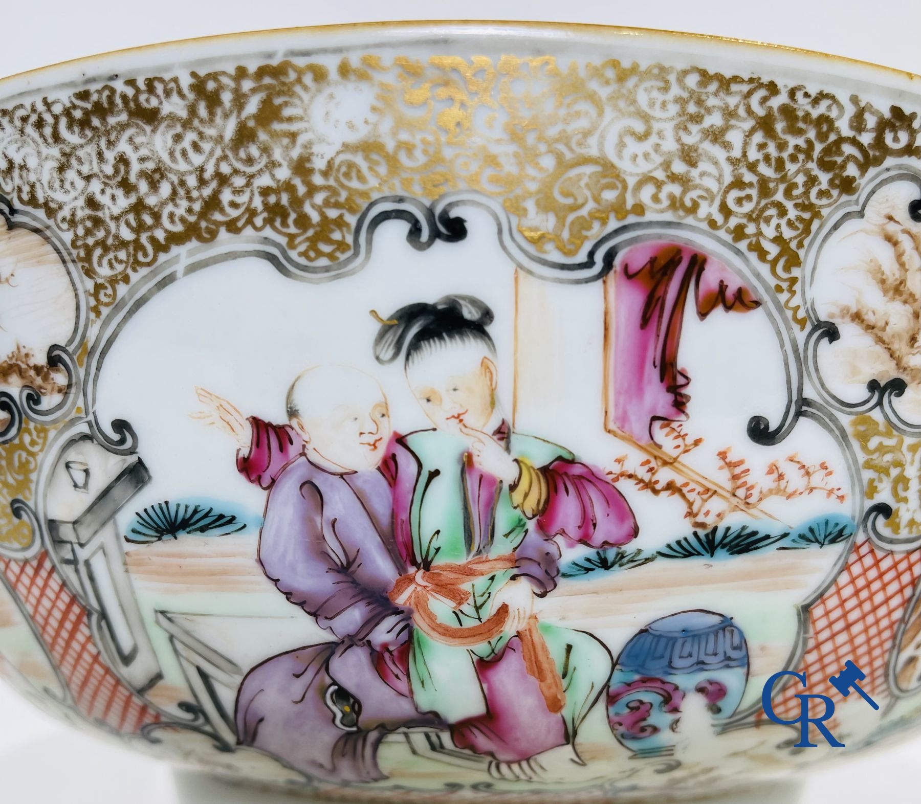 Un grand bol chinois decor mandarin en famille rose, une tasse et soucoupe en famille rose et une figurine en blanc de chine.