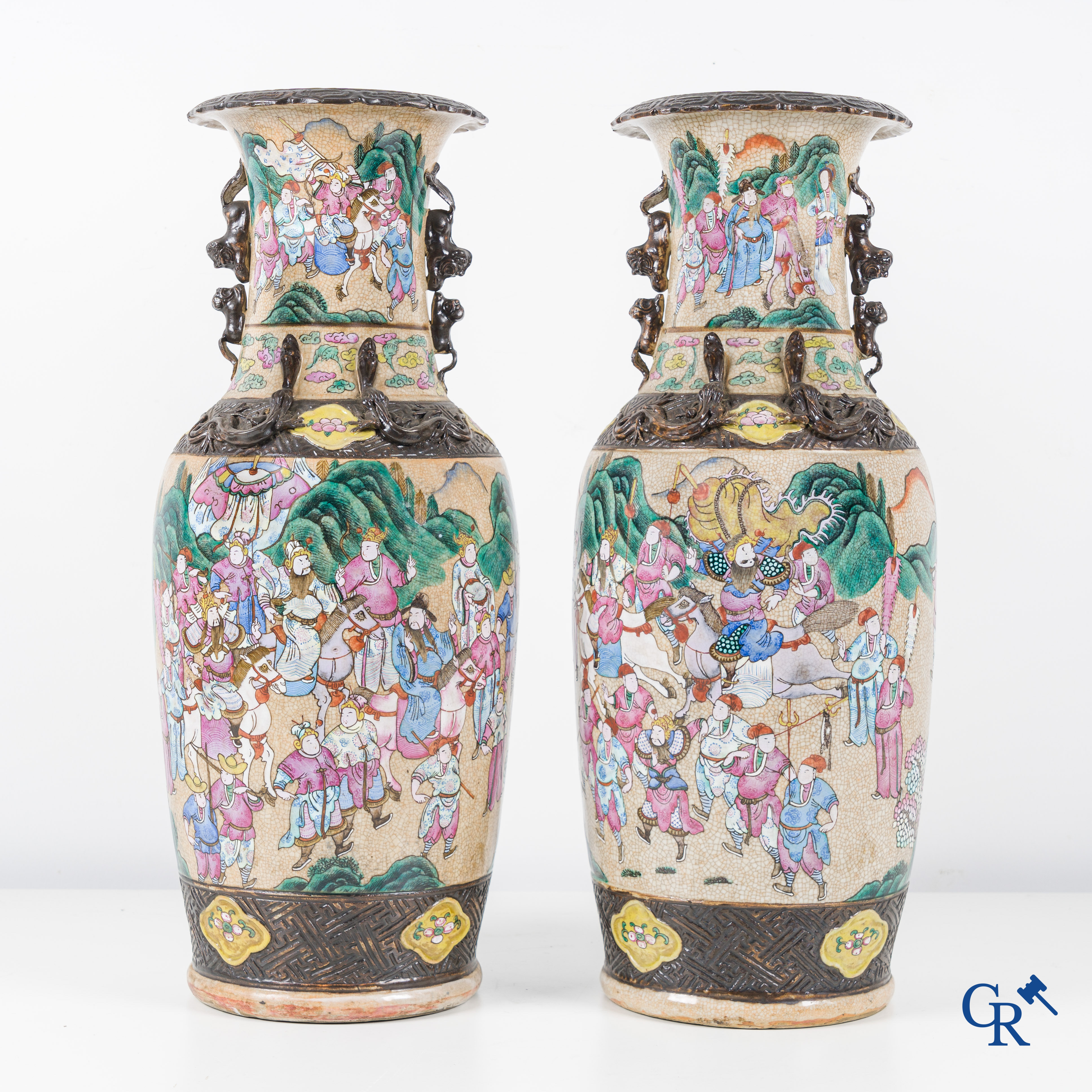 Asian Art, Chinese porcelain, a pair of Nanking vases with a scene of warriors.