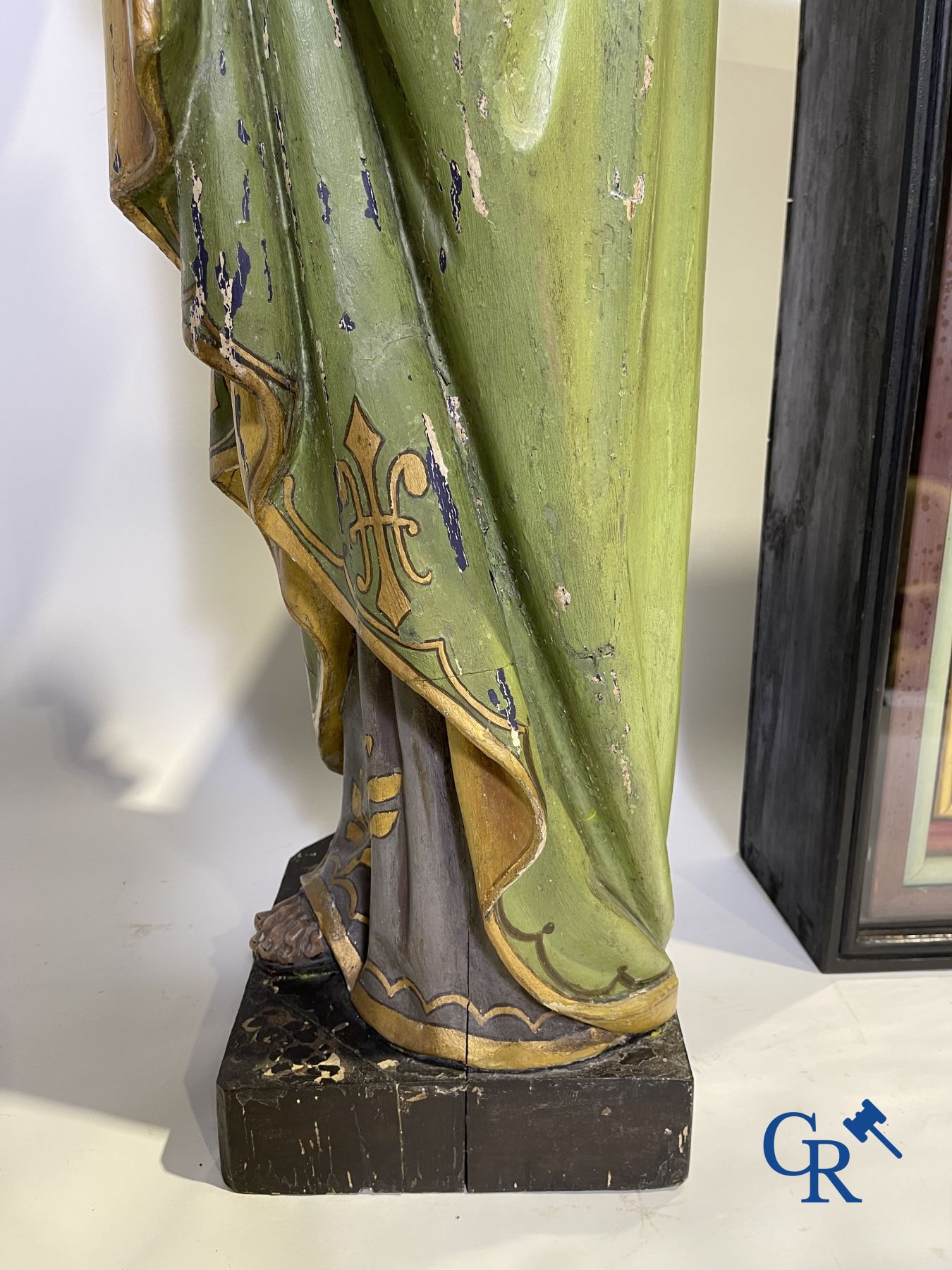 A 19th century wooden statue of Christ and a wooden display case with plaster representation of Mary with child.