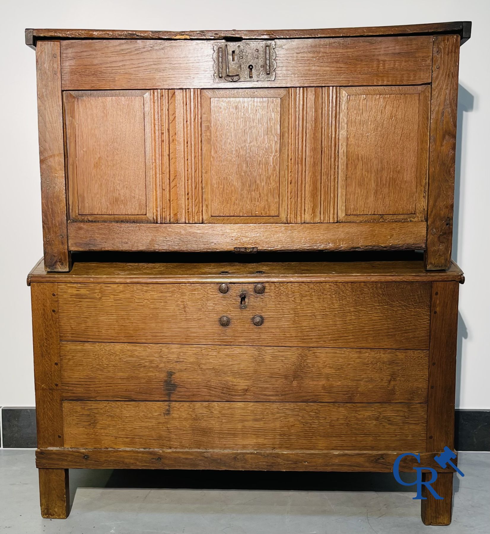 2 oak chests and an antique cast iron fireplace plate.